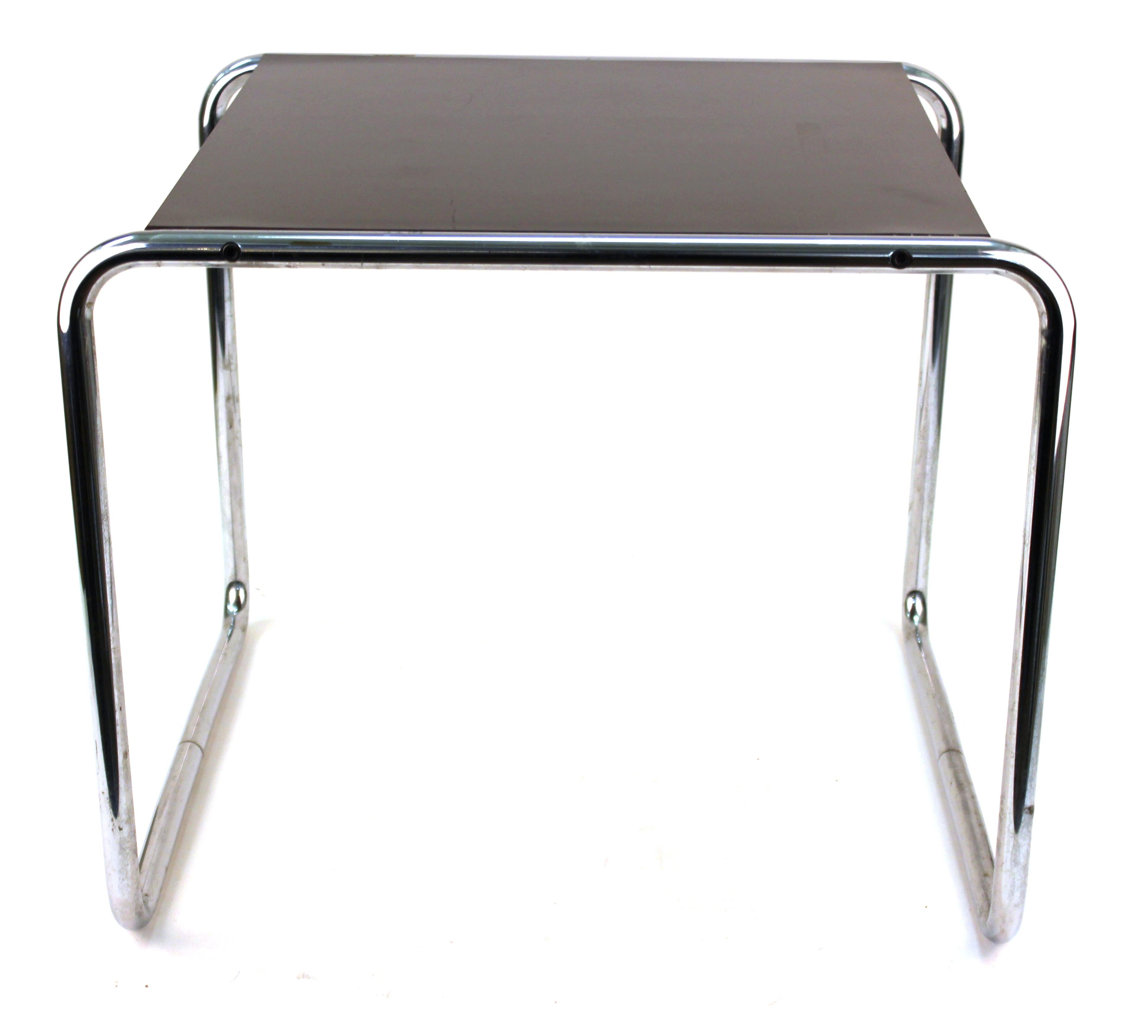Modern 'Laccio' side table designed by Marcel Breuer for Italian maker Gavina in black laminated wood top with a tubular steel frame. The piece dates from the 1960s and has part of its original makers label on the bottom. In great vintage condition