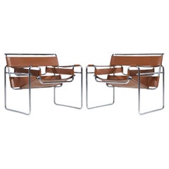 Marcel Breuer pour Knoll Chaise longue Wassily en acier inoxydable et cuir - Paire