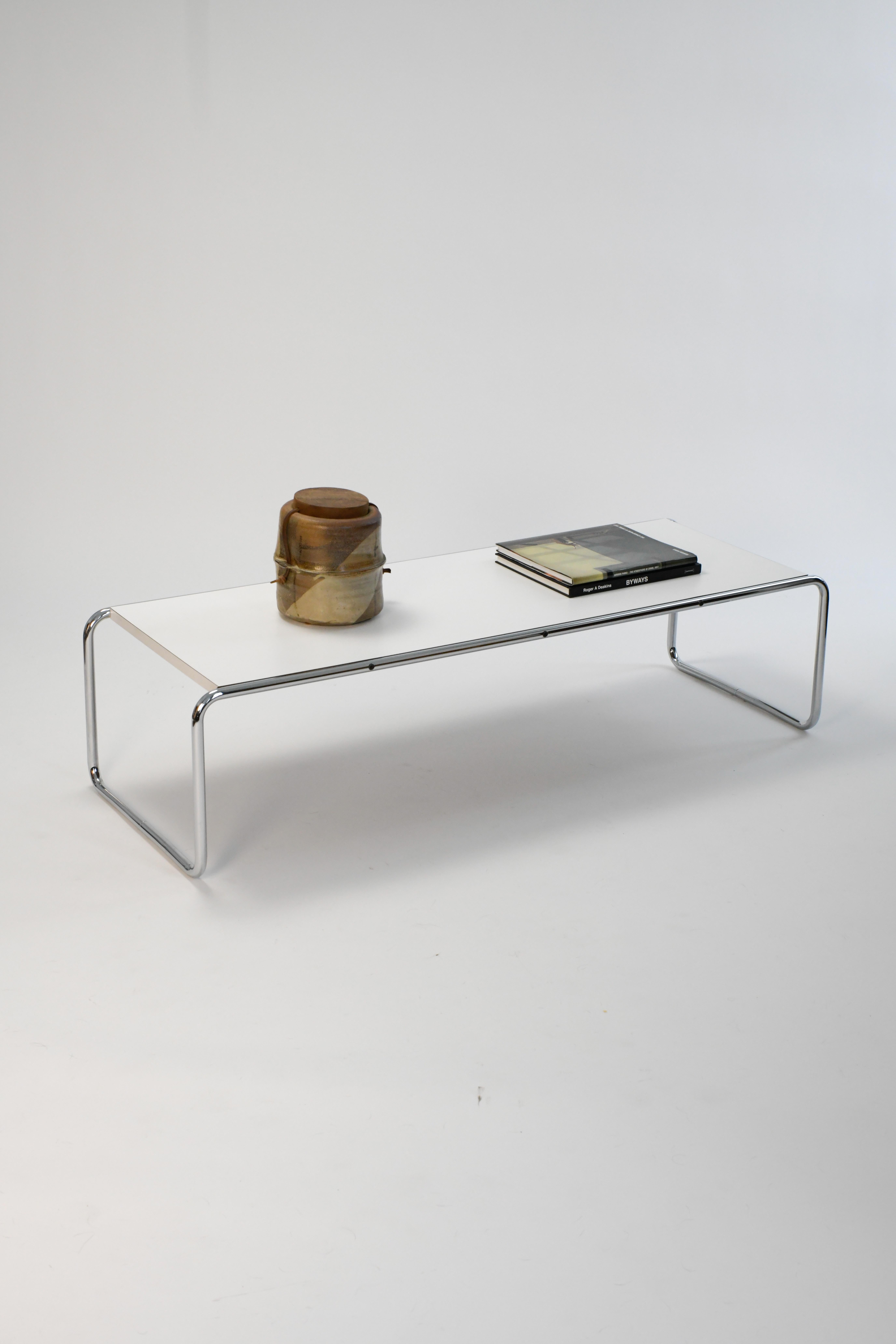 Beautiful 1980s Laccio Coffee Table by Marcel Breuer for Gavina. 

This coffee table is in good vintage condition with only some very minor pitting to the chrome base and a couple small scratches to the table top. Overall presents well and is ready