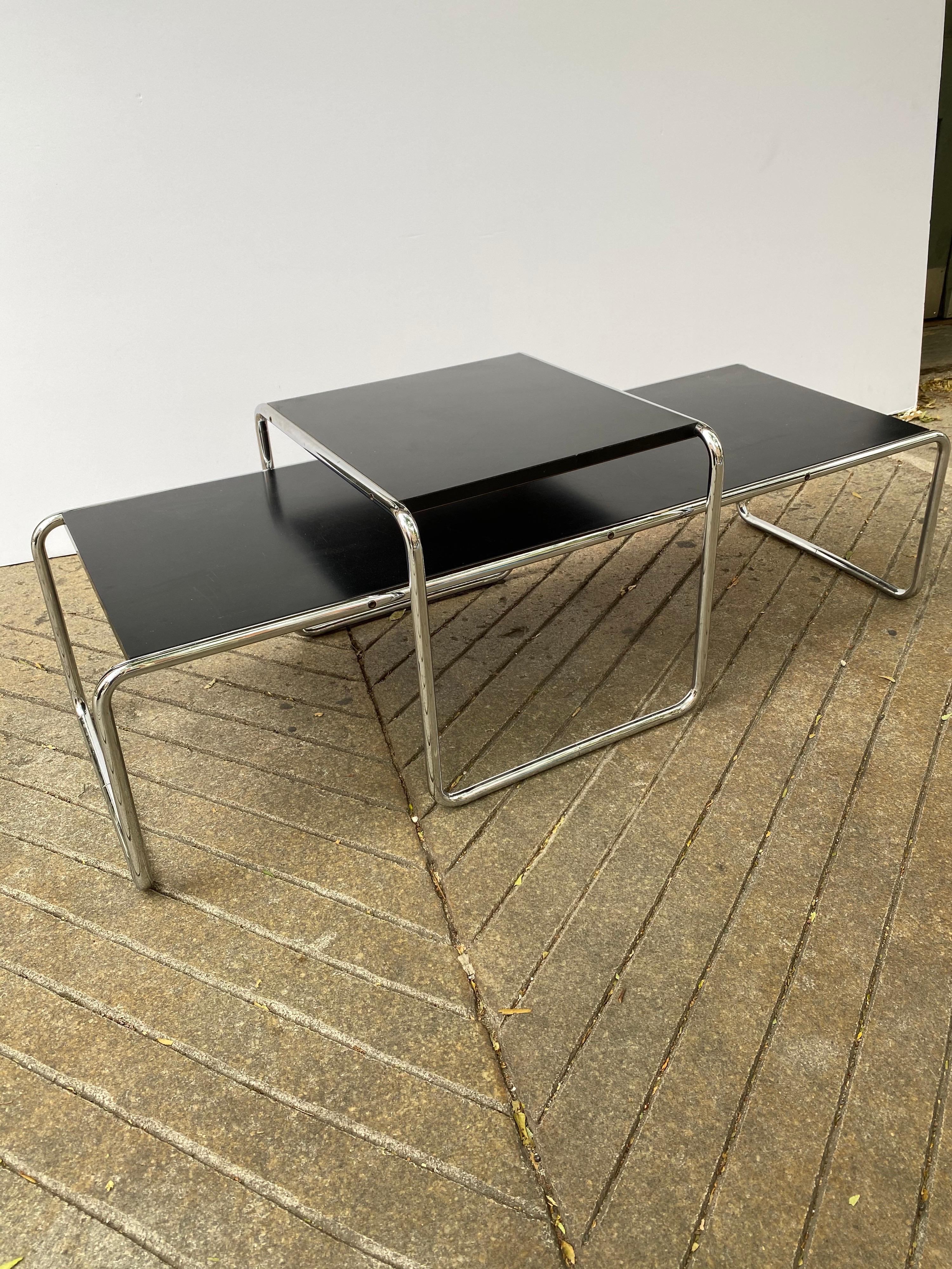 Marcel Breuer Laccio tables, one longer coffee table model and the Nesting Companion Table. Classic Early Tubular Design that functions and fits into many spaces! Small Table Measures 18.75 x 21.5 and 13.5 tall. Coffee table measurements below.