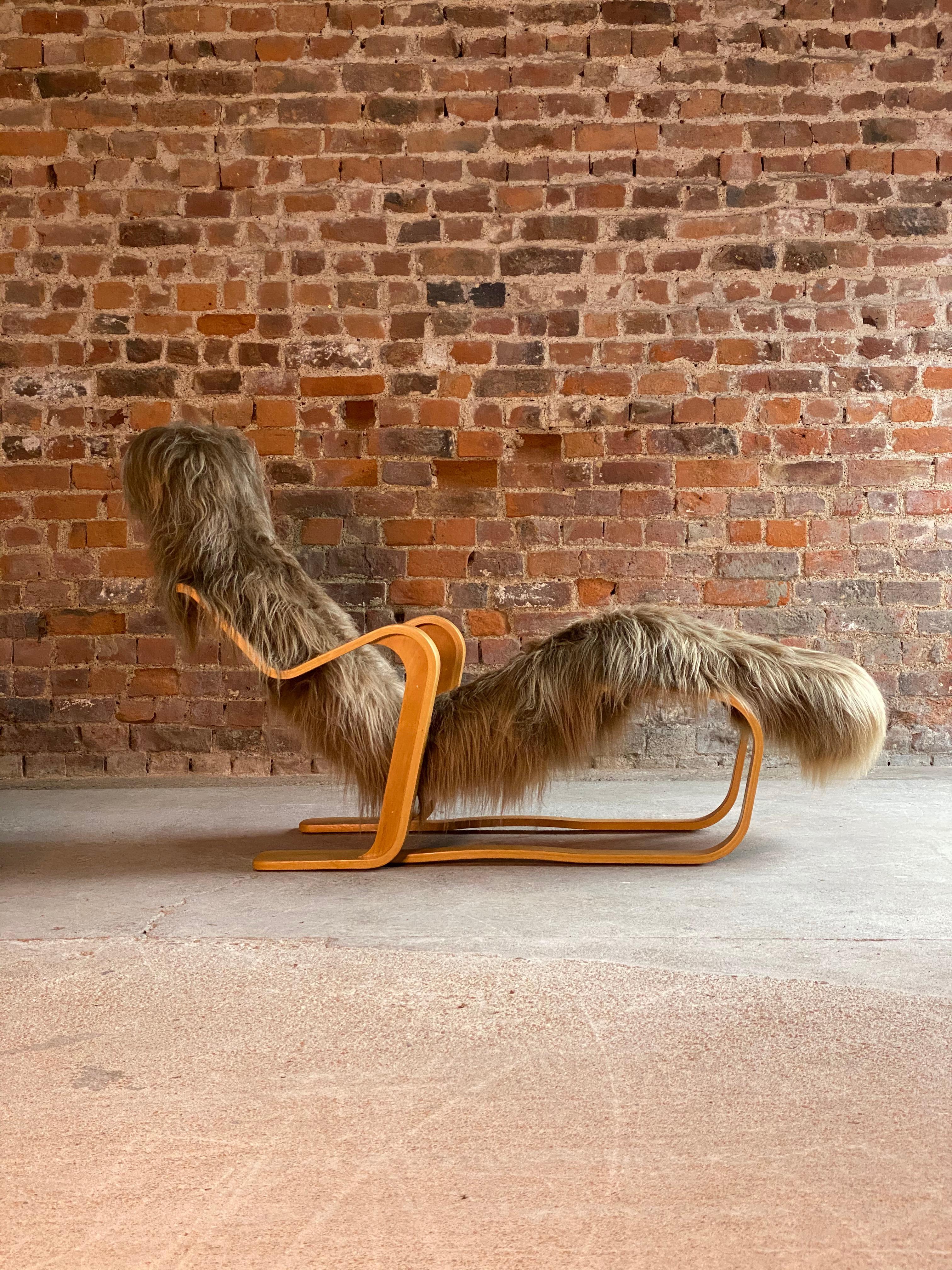 Marcel Breuer long chair in Icelandic long haired sheepskin by Isokon circa 1970 Bauhaus

Marcel Breuer 'Long Chair' birch bent ply with Icelandic long haired sheepskin hide by Isokon circa 1970s, the ‘Long chair’, with its bent frame of laminated