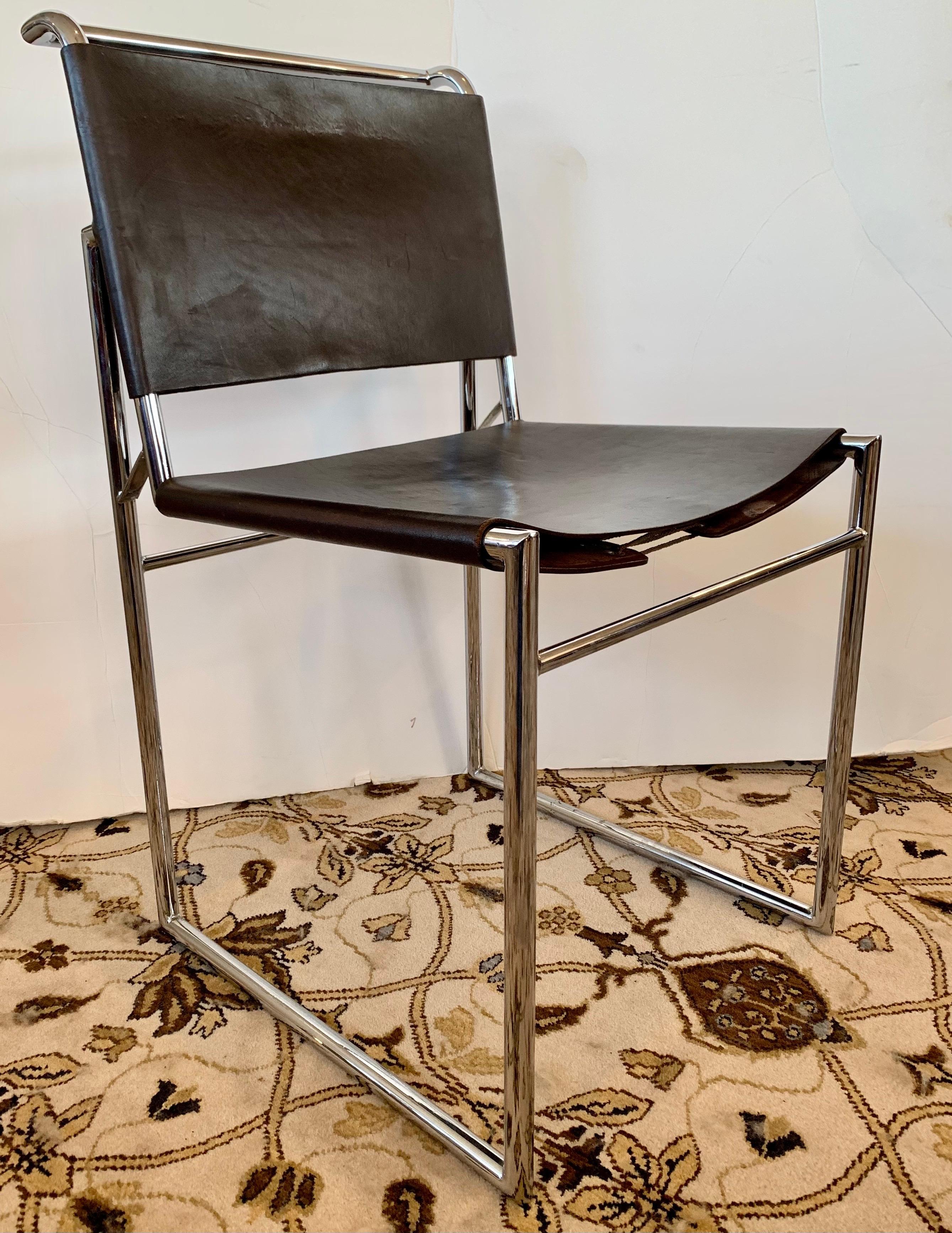 A matching set of Marcel Breuer B40 dining chairs. These chairs feature heavy chrome, dark brown leather and the coveted leather corset system at backrest and seat bottom. The color is a darker shade of brown - see pics. Age appropriate wear. Only