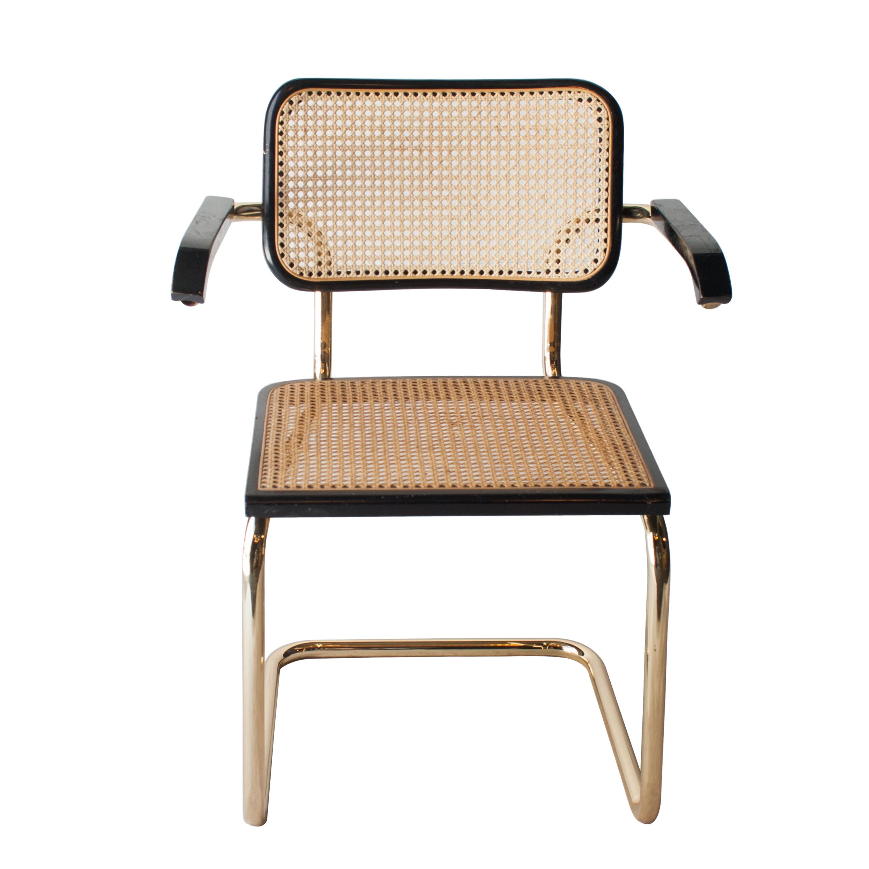 Set of 6 Cesca chairs designed by Marcel Breuer in 1962 and produced in Italy in 1960. Brassed tubular structure, wood frame lacquered in black with braided natural fiber seat and back.
  