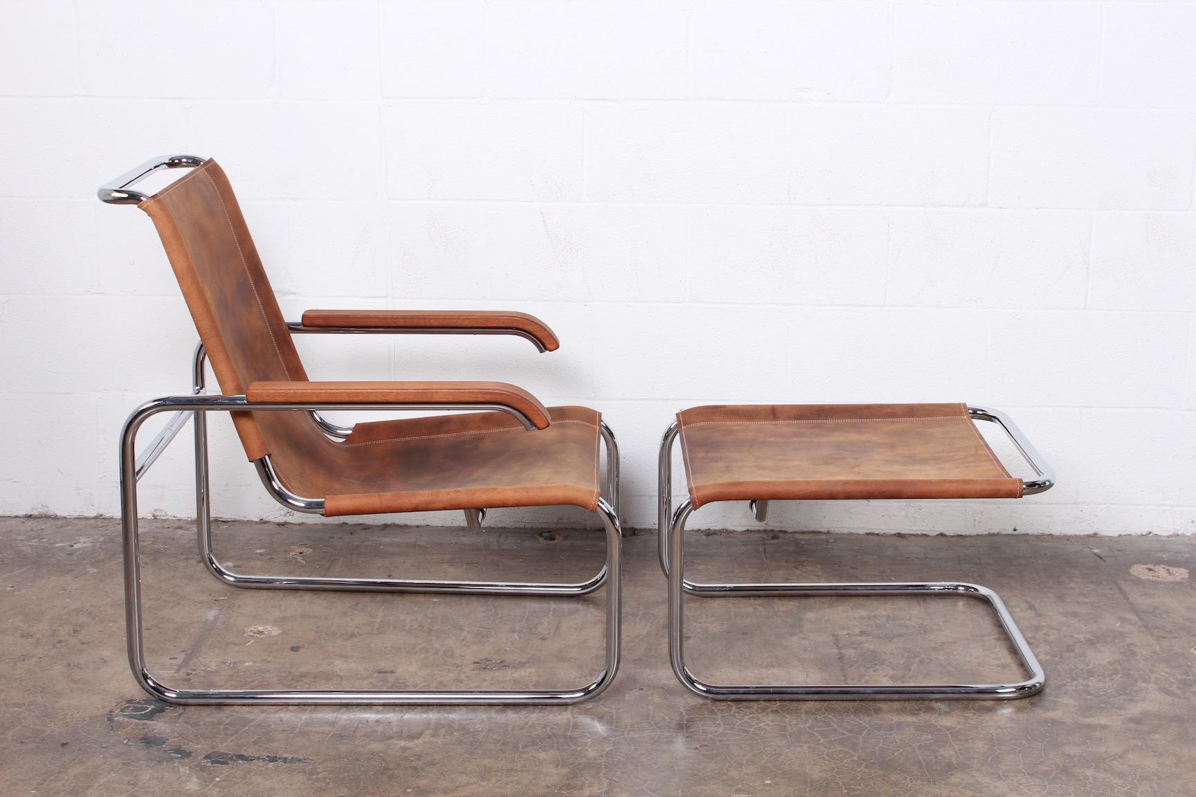 A Marcel Breuer S35 lounge chair and ottoman in Buffalo hide by Thonet.