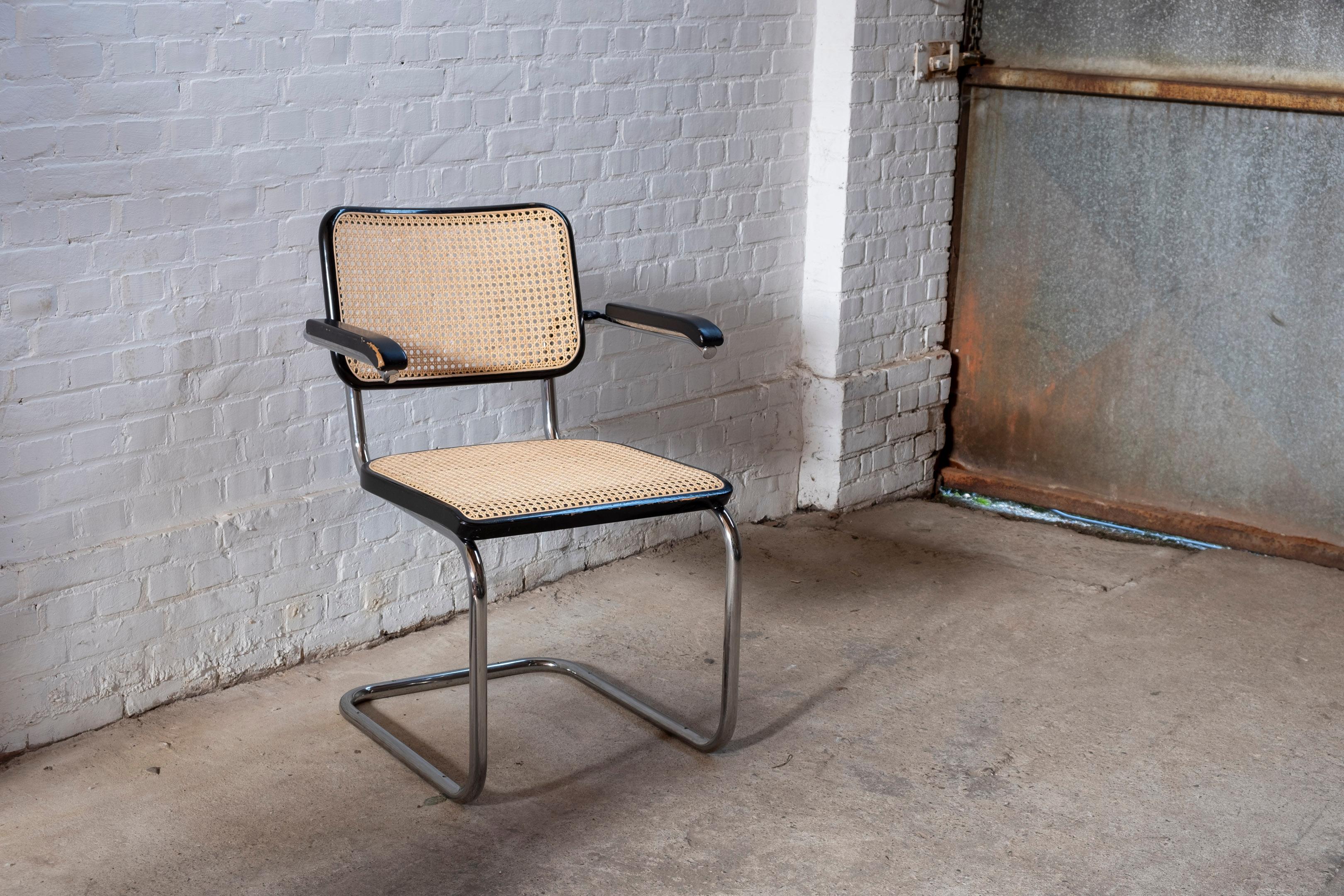 Iconic tubular steel chair model S 64, designed by Marcel Breuer for Thonet in 1928. The frame is made of chromed tubular steel. The seat and backrest are covered with the 