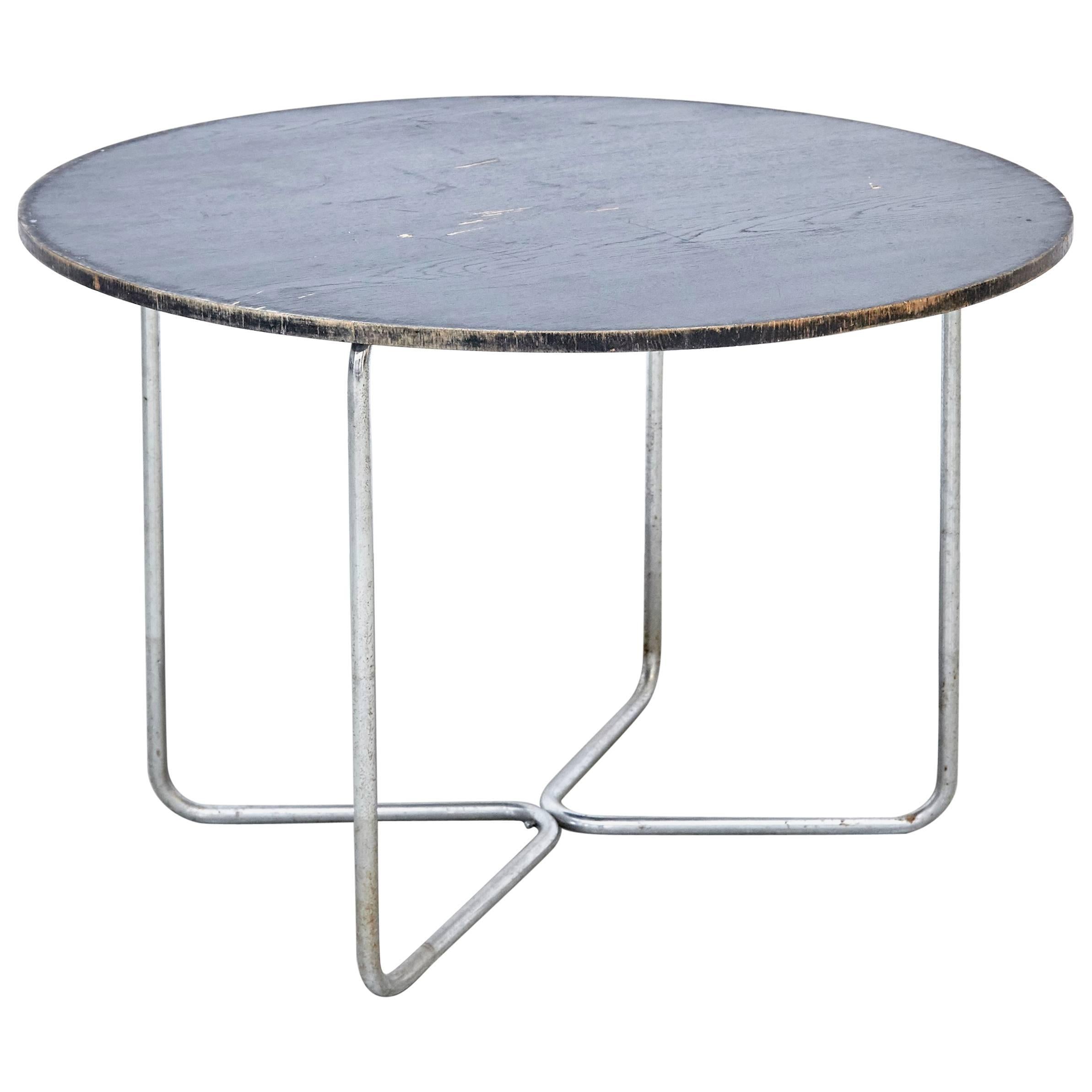 Table by Marcel Breuer 
Manufactured, circa 1940.

In good original condition, with minor wear consistent with age and use, preserving a beautiful patina.

Marcel Breuer (1902-1981), was a Hungarian-born modernist, architect and furniture