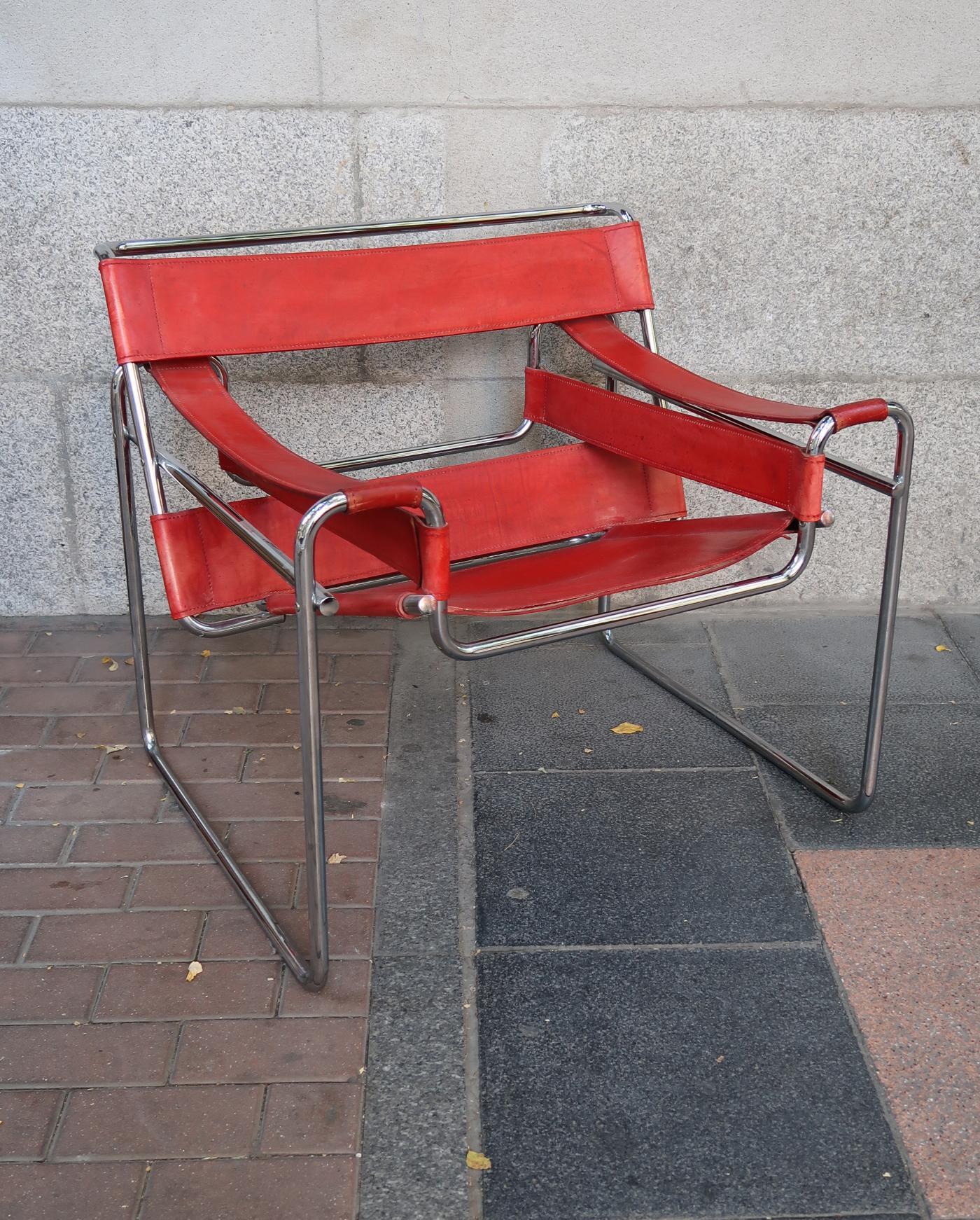 Marcel Breuer, Wassily red leather and chromed pair of armchairs, Italy, 1970.