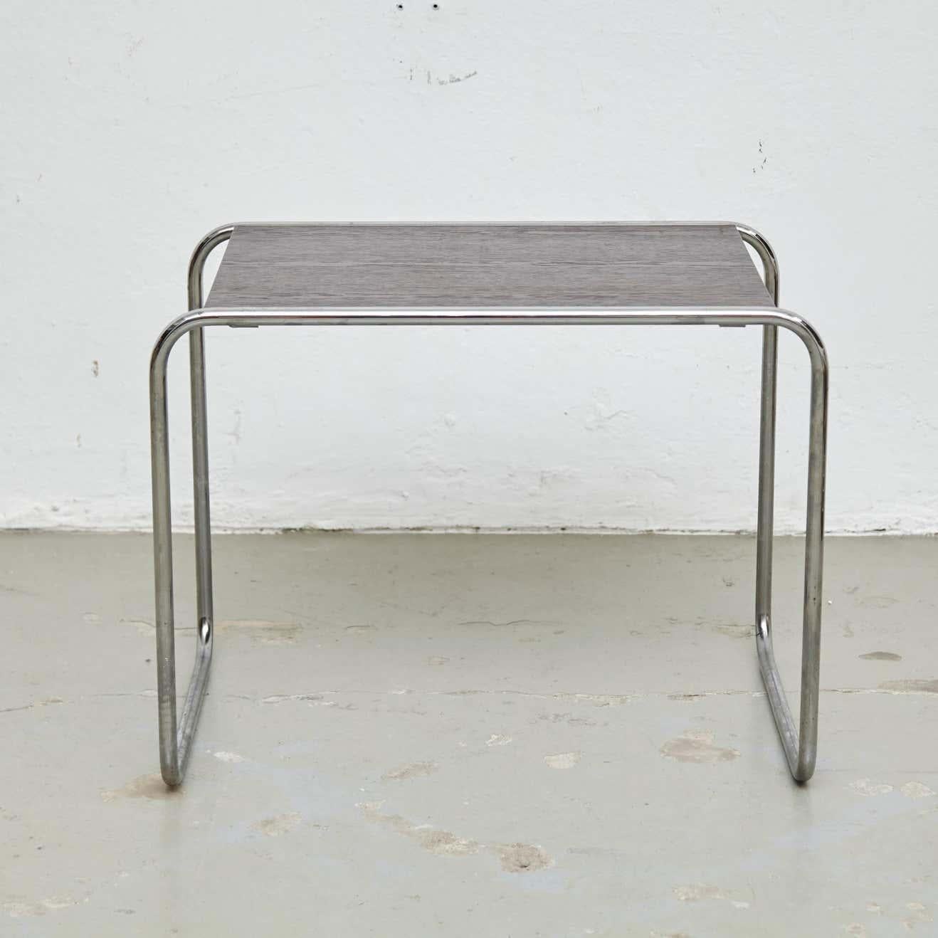 Table designed by Marcel Breuer in early 20th century.
Manufactured by Gavina, Italy, circa 1960.

In original condition, with minor wear consistent with age and use, preserving a beautiful patina.

Materials:
Wood
Steel

Dimensions:
D 45