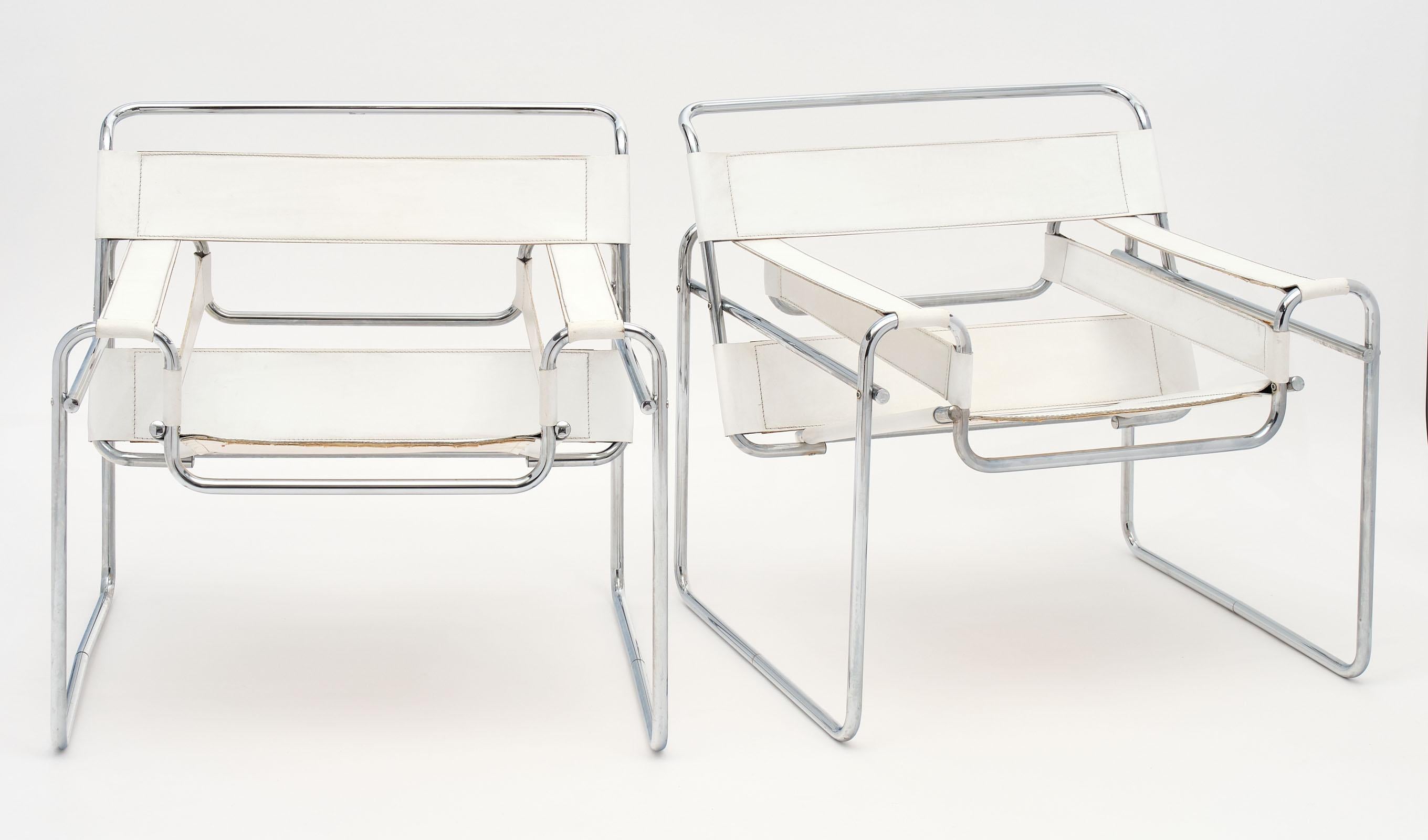 Pair of armchairs in the manner of Marcel Breuer’s Wassily design. These chairs are made of white leather and chromed steel in the iconic chair design by Breuer.