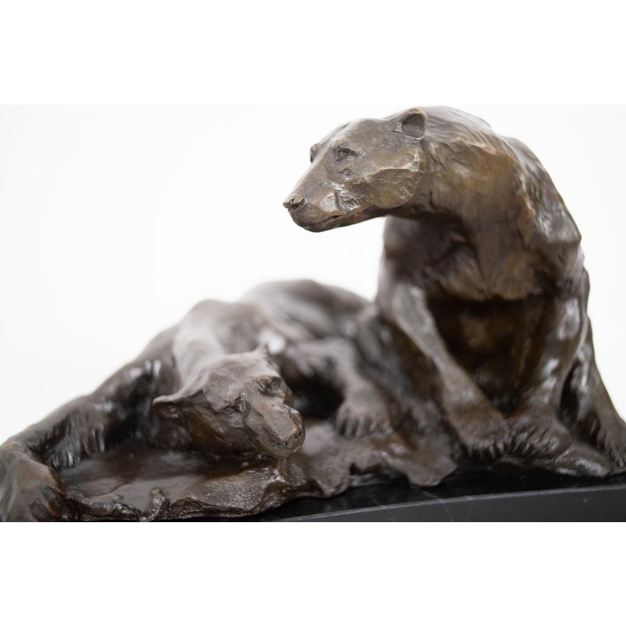 This rare bronze sculpture by Marcel Debut (1865–1933) presents a unique departure from his more frequently encountered mythological and allegorical themes, venturing into the realm of animalier sculpture. The piece depicts two polar bears, one