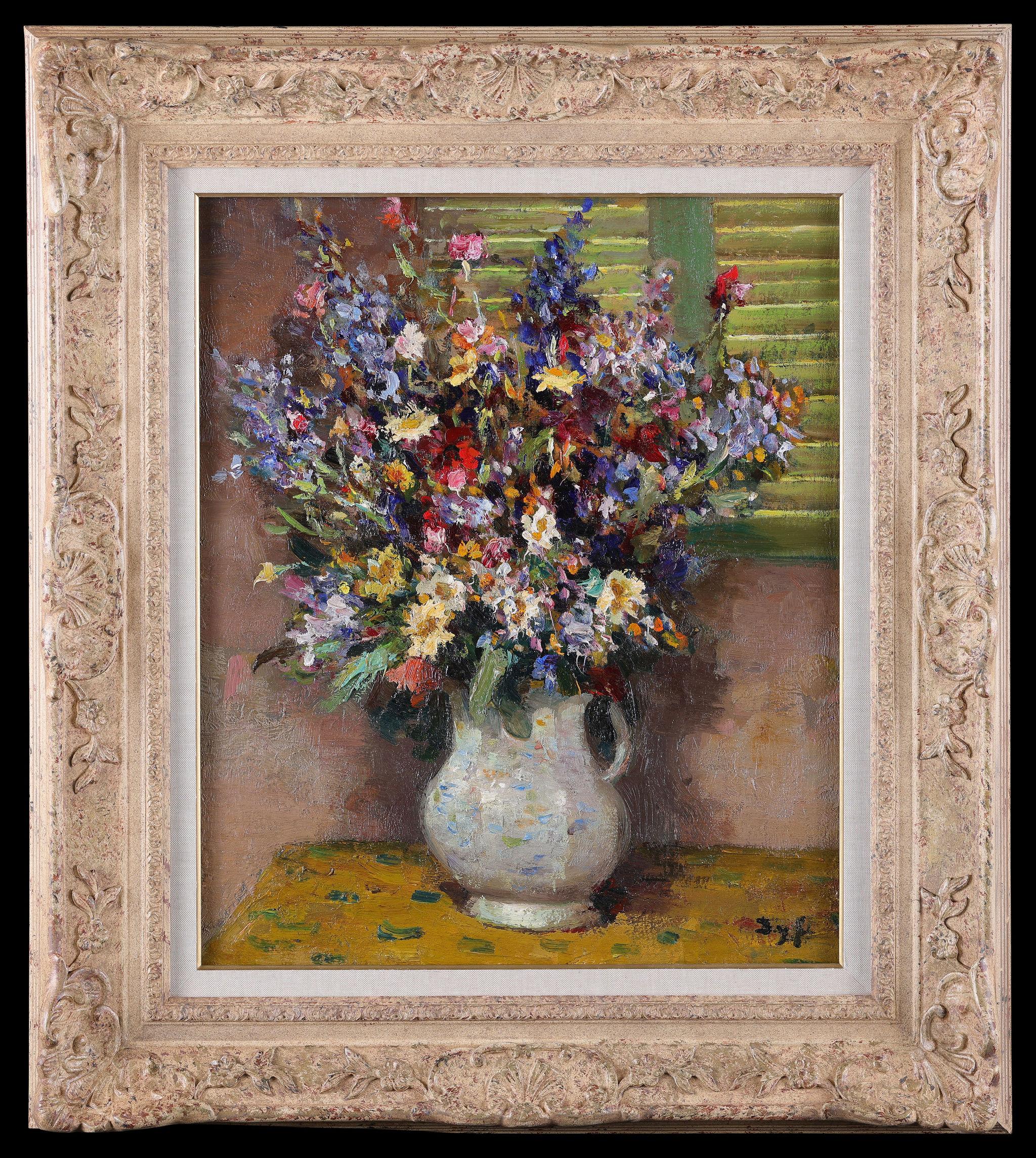 Une nature morte représentant des fleurs sur une table, de Marcel Dyf. Huile sur toile