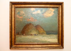 Vista de una playa con rocas, barco varado en Blues