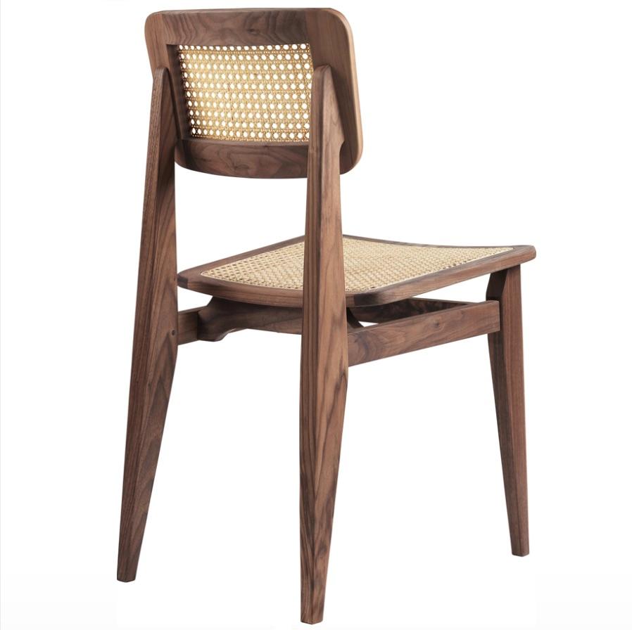 Marcel Gascoin C-Chair dining chair in American walnut. Originally designed by Marcel Gascoin in 1947 for post-war housing in France, the C–Chair has become one of the legendary French architect and designer’s most iconic and enduring designs.