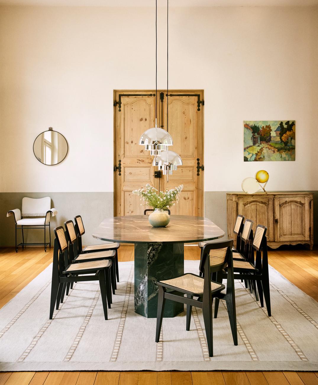 Marcel Gascoin C-Chair Dining Chair in Black-Stained Oak for GUBI 

Originally, designed in 1947, this authorized re-edition from GUBI features the same elegant shape and sturdy construction as the original. Gascoin originally created the 'C-Chair'