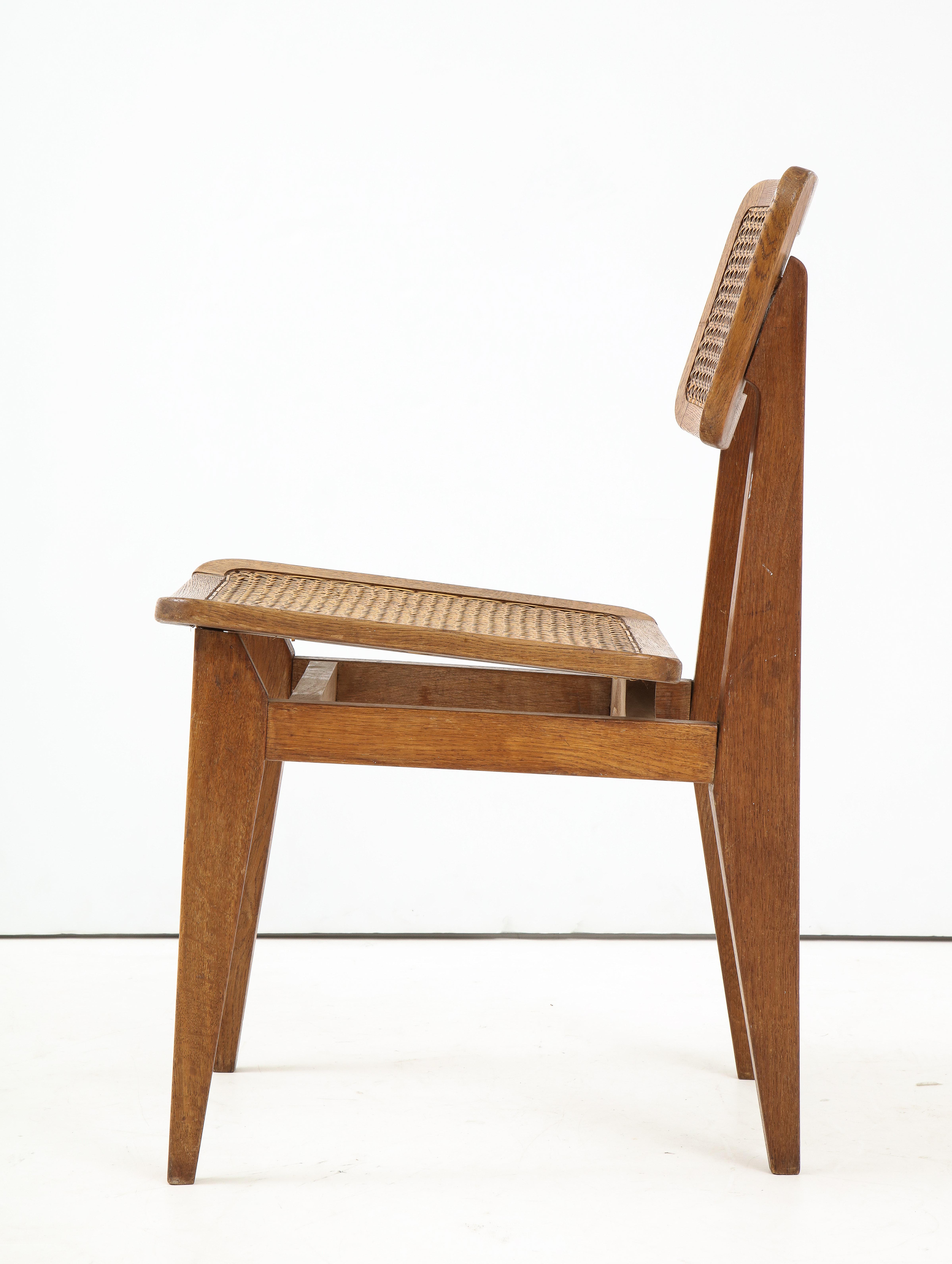 Marcel Gascoin (1907-1986)
‘C’ chair, oak, caning (original & good condition), Edition ARHEC, France, circa 1947-1950

Measures: H 30.75, W 16, D 20.5 in.