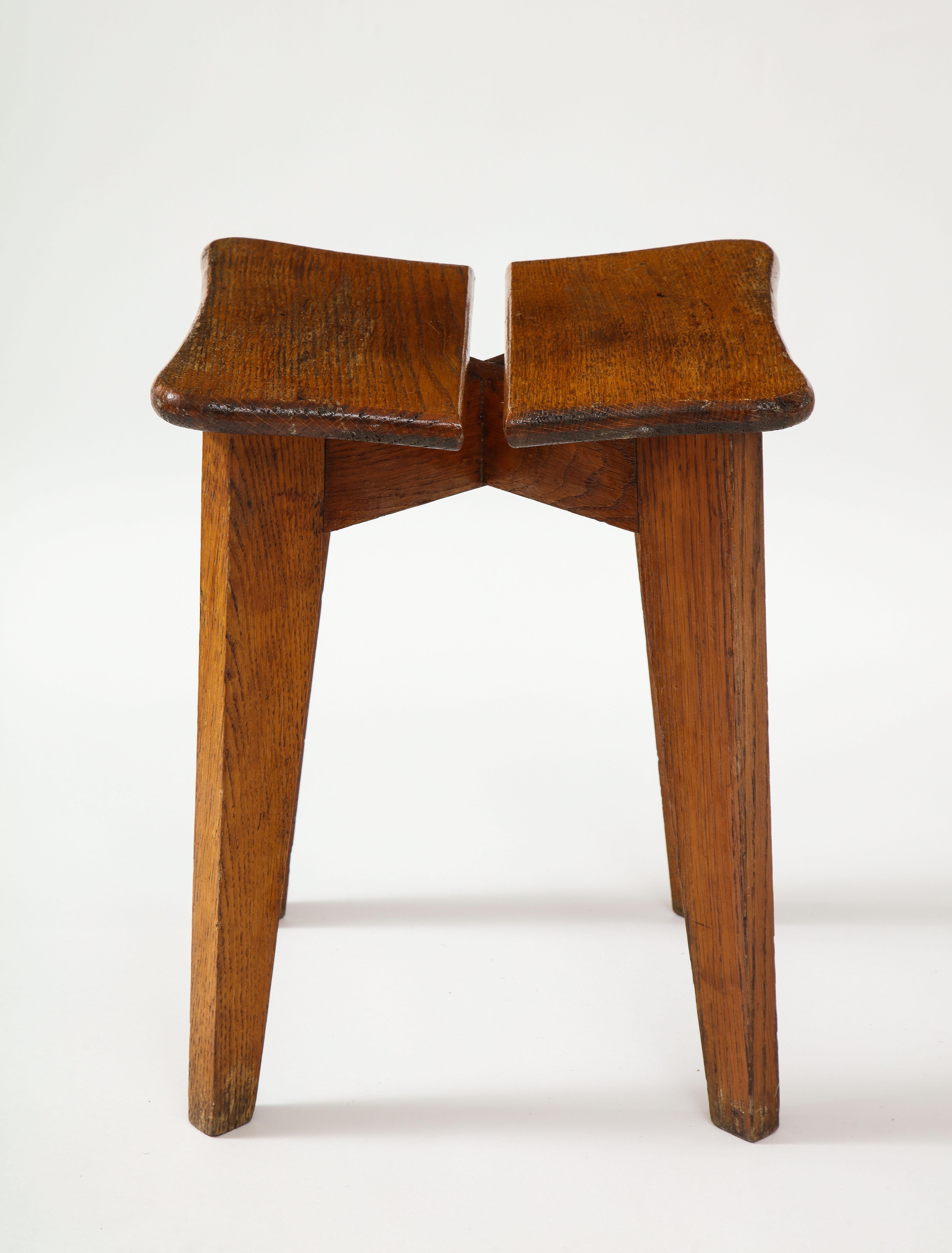 This stool is in the style of Marcel Gascoin and has a beautiful patina