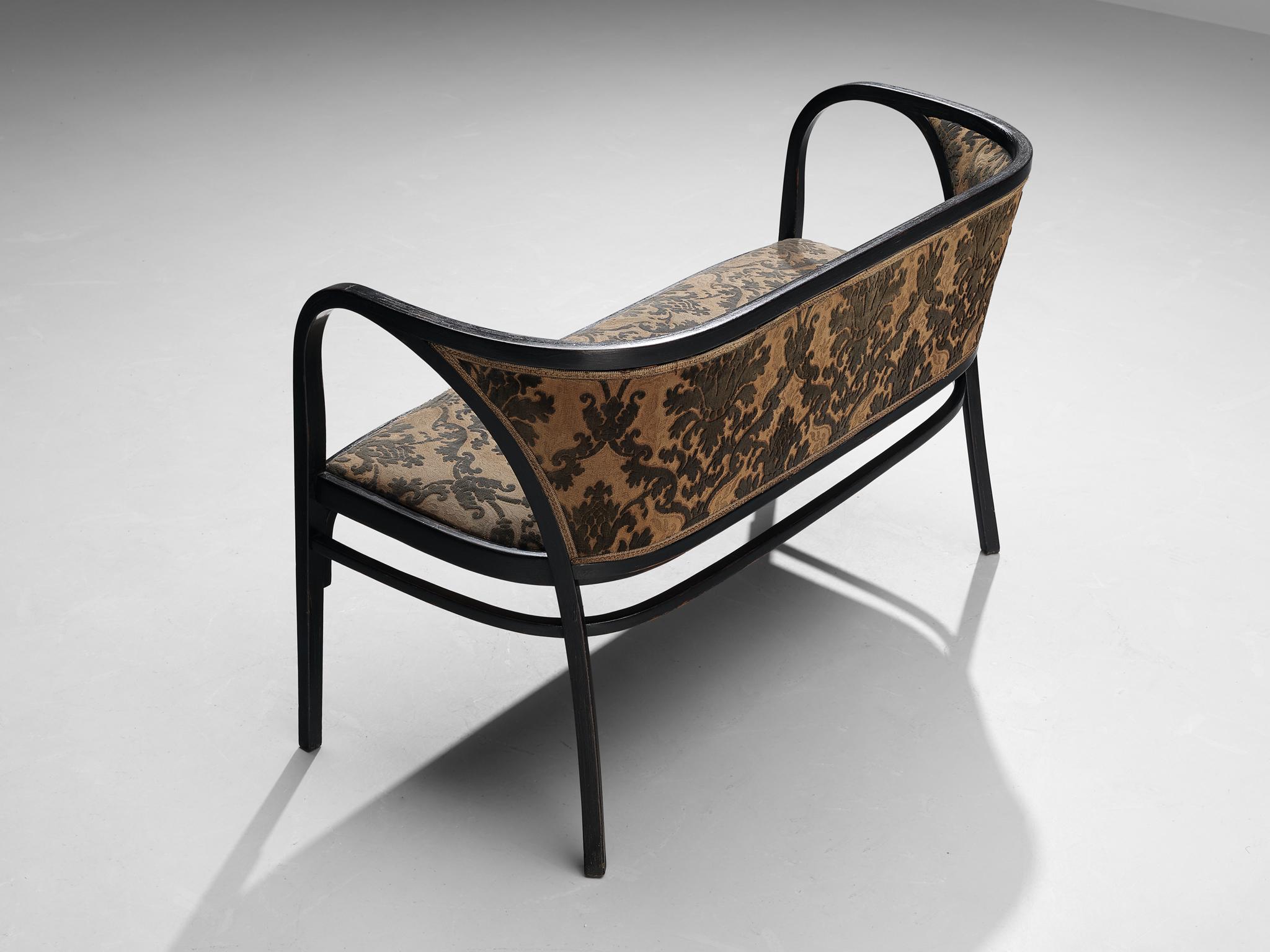 Marcel Kammerer for Thonet, sofa bench model 6217, bentwood and fabric, Austria, ca. 1910

An elegant bentwood settee designed by Marcel Kammerer and manufactured by Thonet, Austria, circa 1910. The sofa is made of dark stained beech wood in a dark