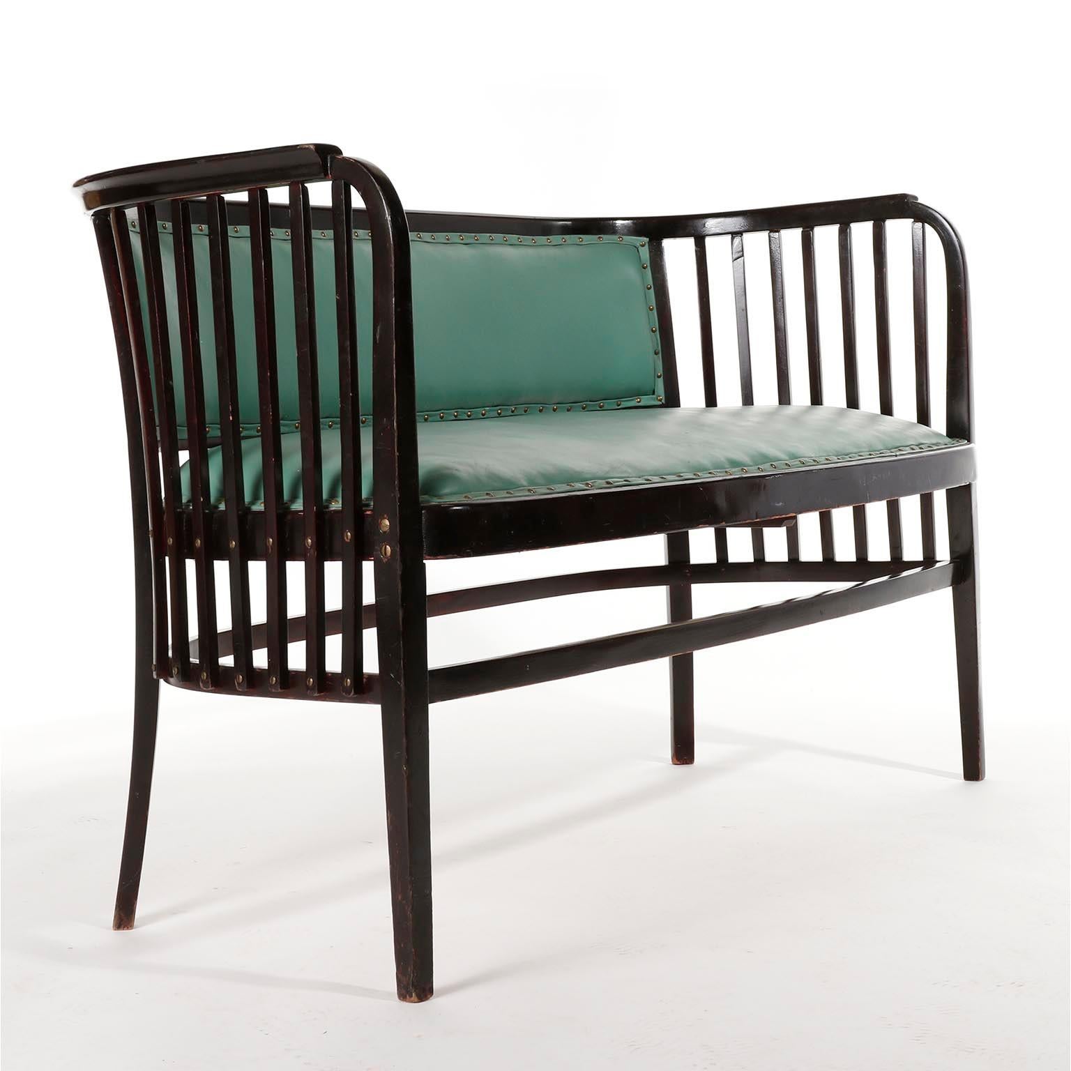 A fantastic settee designed by Marcel Kammerer and manufactured by Thonet, Austria, circa 1910.
It is made of dark or almost black stained beech wood in mahogany tone and French polished, a technique that involves hand applying many thin coats of