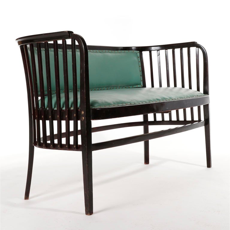 A fantastic settee designed by Marcel Kammerer and manufactured by Thonet, Austria, circa 1910.
It is made of dark or almost black stained beech wood in mahogany tone and French polished, a technique that involves hand applying many thin coats of