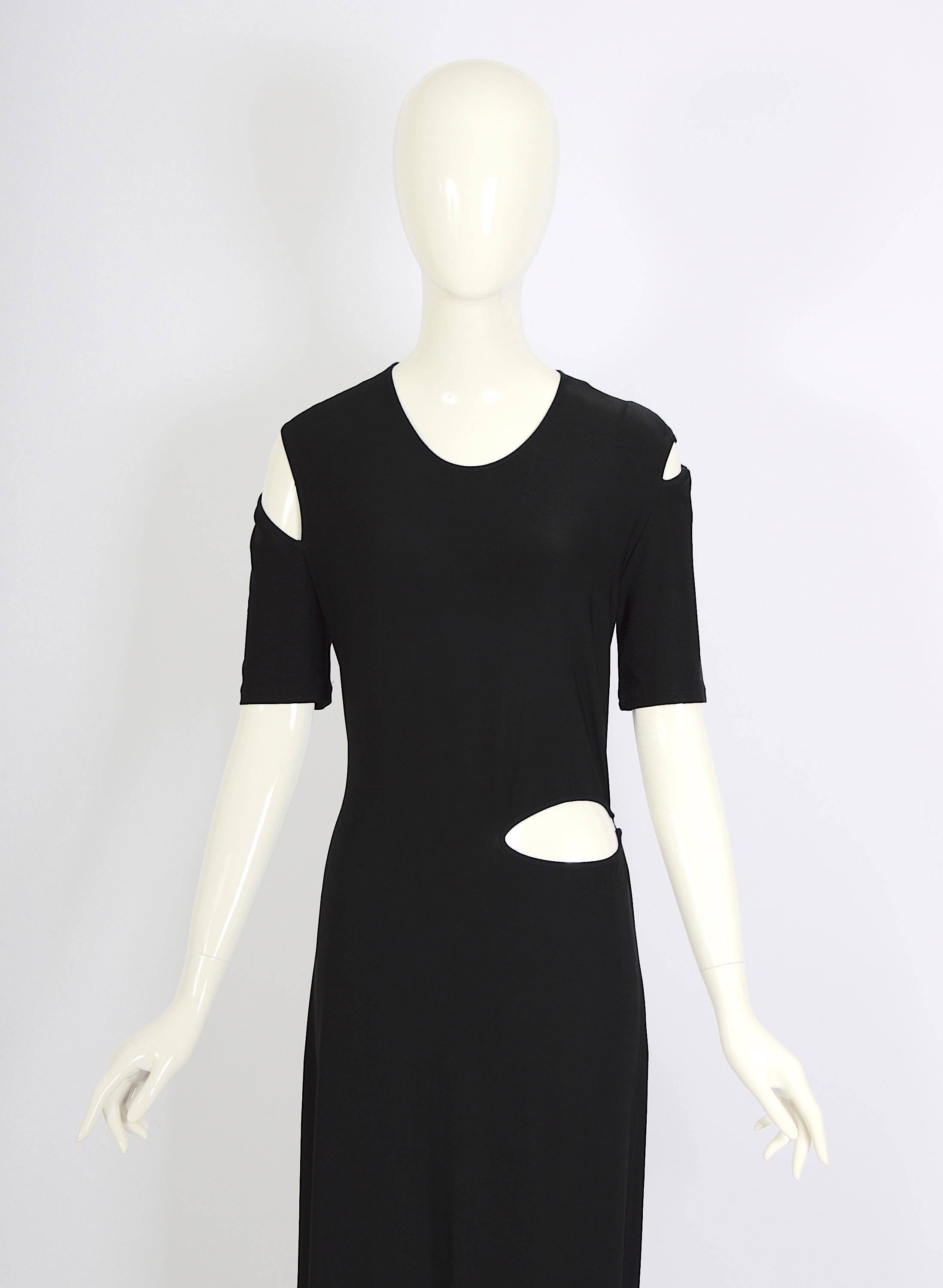 This exquisite long black jersey dress from the 1990s is a vintage piece by the renowned French designer Marcel Marongiu. Originally, the Marcel Marongiu were available at the prestigious Kashiyama Onward boutique on the Boulevard Saint Germain in