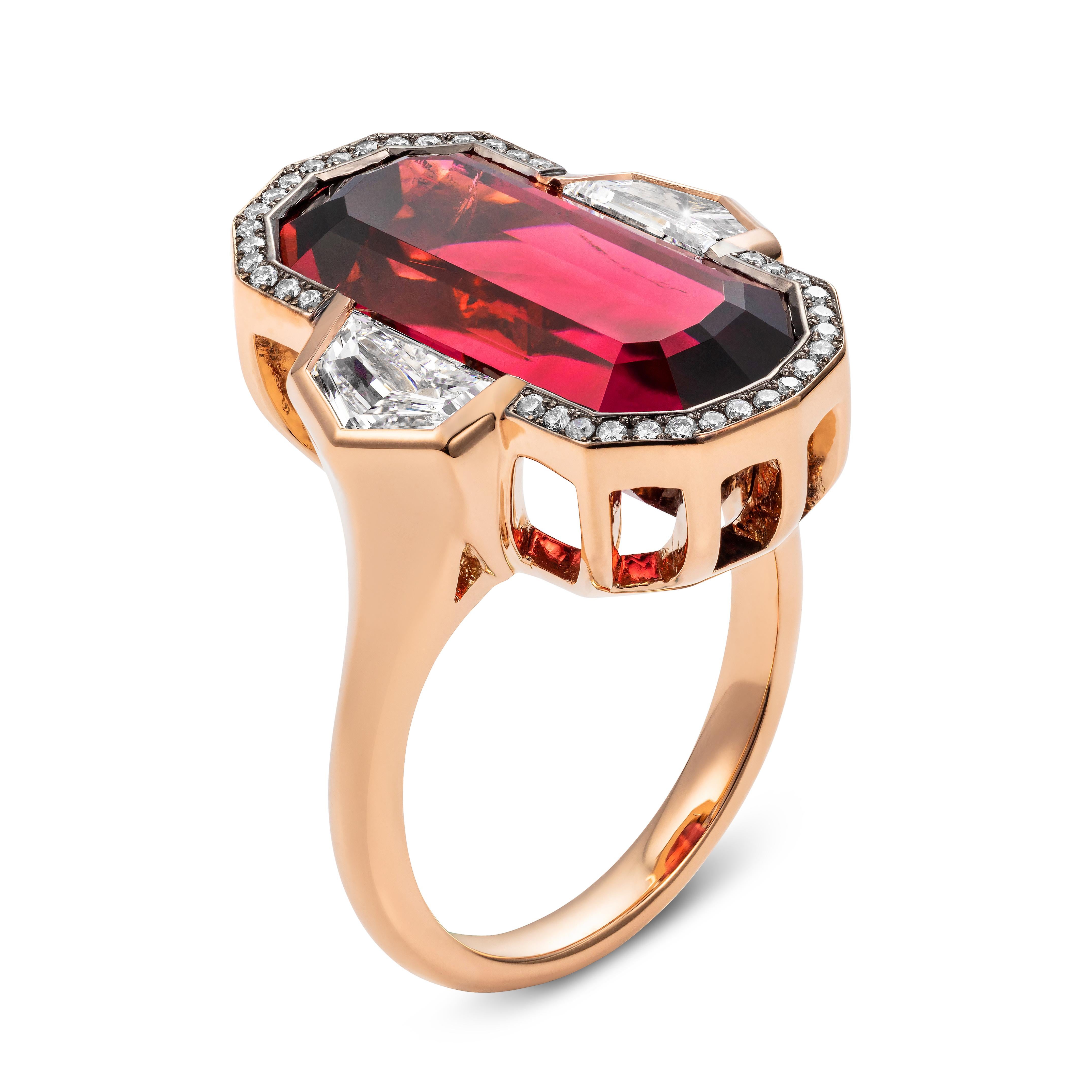 A new addition to our one off designs.  This spectacular ring has striking looks yet everything about it is balanced.  Set seamlessly within the metal, the rubellite tourmaline interacts with the shoulder diamonds creating an angular but flowing