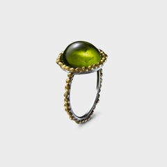 Round Cabochon Peridot Ring set in Platinum and 24 Karat Gold