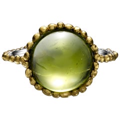 Round Cabochon Peridot Ring set in Platinum and 24 Karat Gold