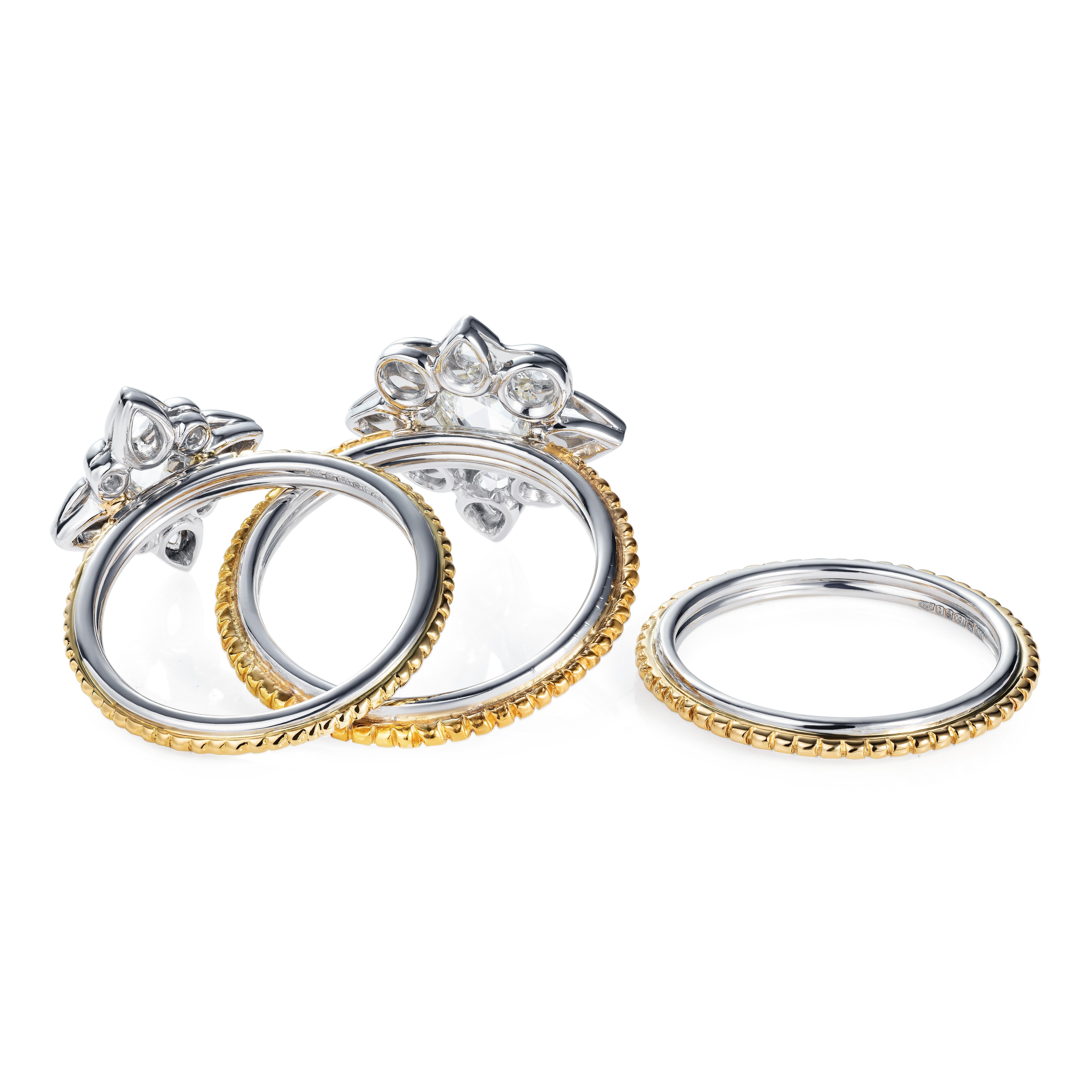 This collection bonds together the beautiful intensity of 24 carat gold with polished platinum to create a luxurious look with a raw and organic style.

This ring was inspired by ancient designs and mixes hidden details with gentle simplicity.   A