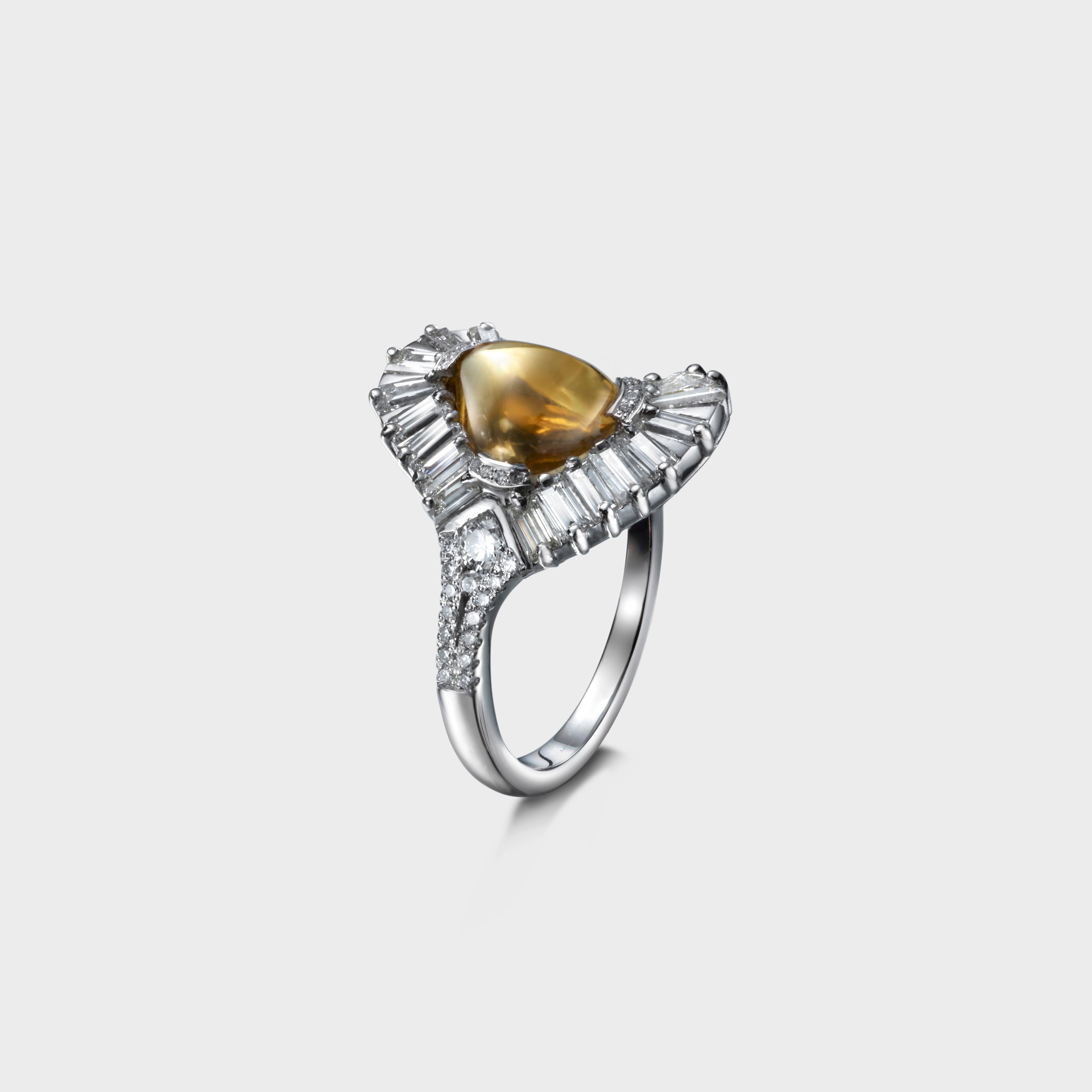 A unique design with flowing lines. A 9.5 x 7.5 mm loaf cut citrine sits at the centre surrounded with 21 baguette diamonds weighing 1.55 carats .  The semi rub-over claws that hold the amethyst are delicately set with 0.8 mm diamonds. One side of
