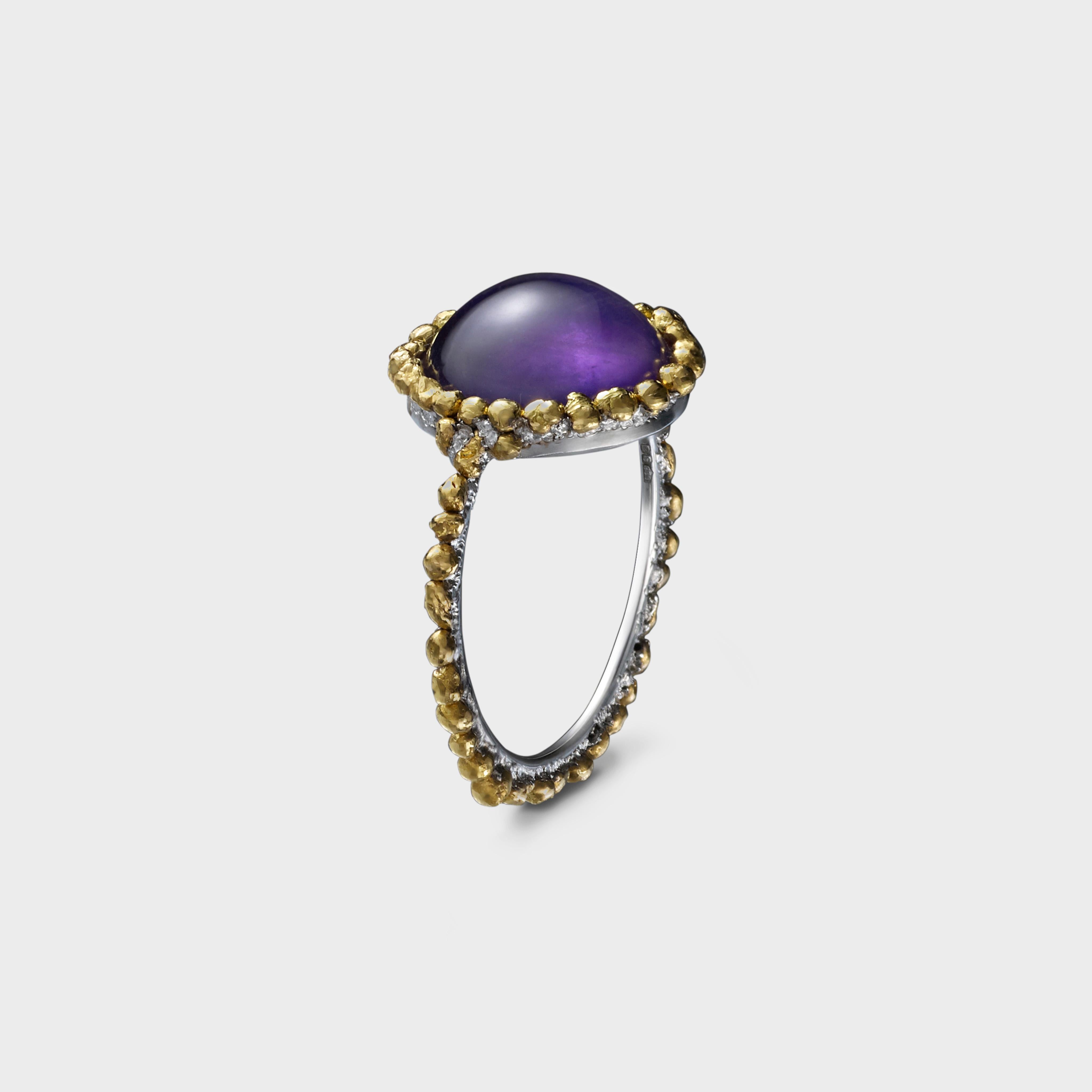 A beautiful natural amethyst surrounded by a raw halo of 24 karat gold beads bonded to platinum combining strength with organic beauty. 

This ring is part of Saisons, a playful collection inspired by the natural beauty of coloured stones that