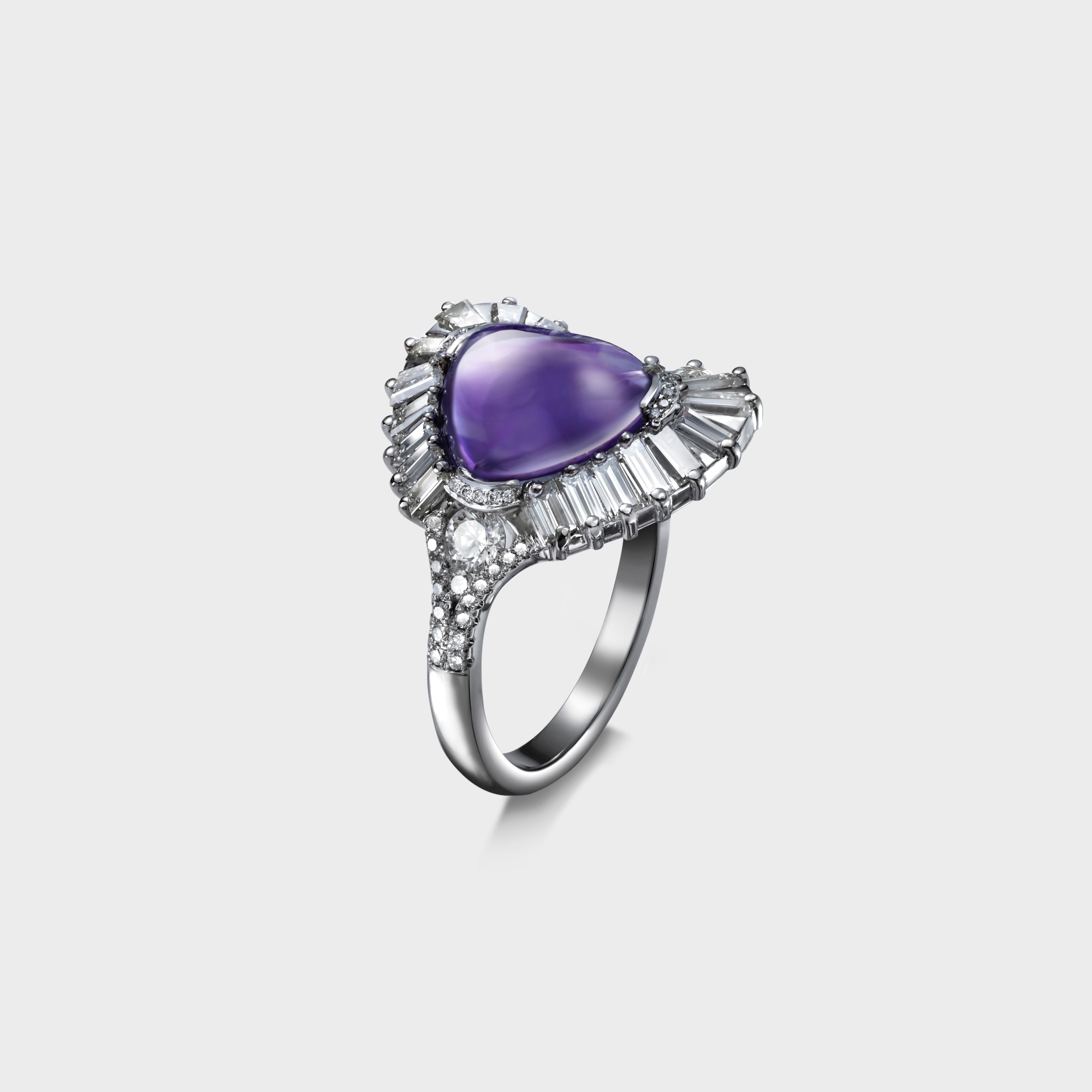 A unique design with flowing lines. A 10.5 x 9.5 mm loaf cut purple amethyst at the centre surrounded with 21  baguette diamonds weighing 1.55 Carats.  The semi rub-over claws that hold the amethyst are delicately set with 0.8 mm diamonds. One side