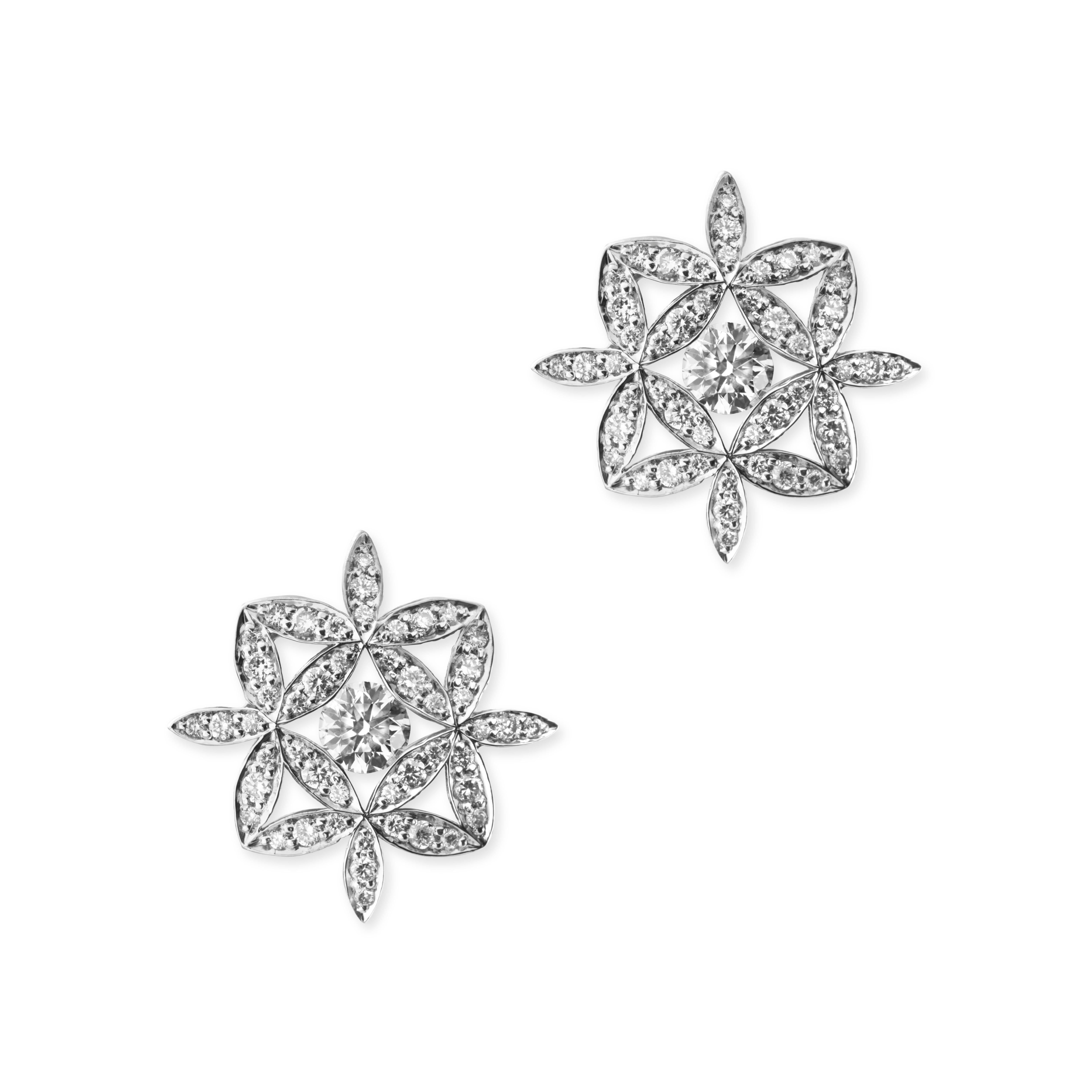 With 82 diamonds and an elegant floral pattern, these earrings drip with finesse and class.  Made in platinum, they depict the flower of life.  At the centre of each earring, a 3.5 mm 0.16 carat F colour VS clarity round brilliant diamond is held by