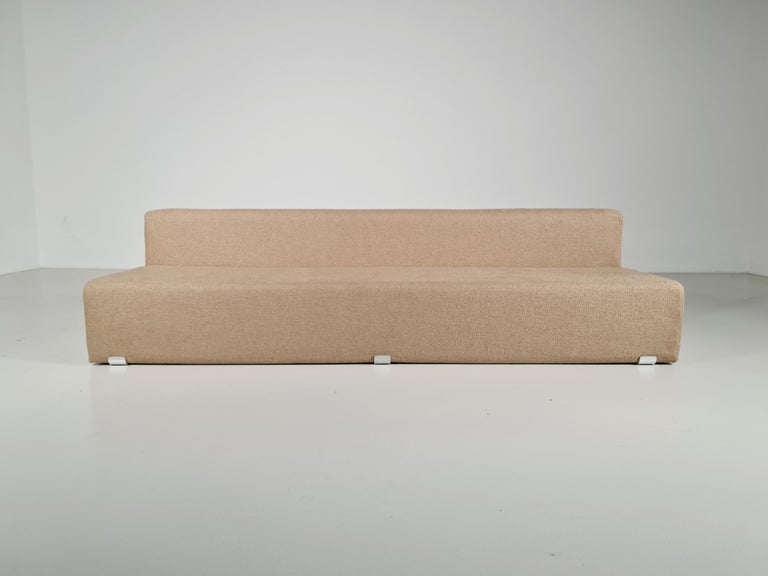 Marcel 3-seater sofa, designed by Kazuhide Takahama and manufactured by Gavina, features a shaped polyurethane structure with polished aluminum brackets. Reupholstered in a beautiful beige Tactile bouclé by Kirkby Design. The Marcel collection, a