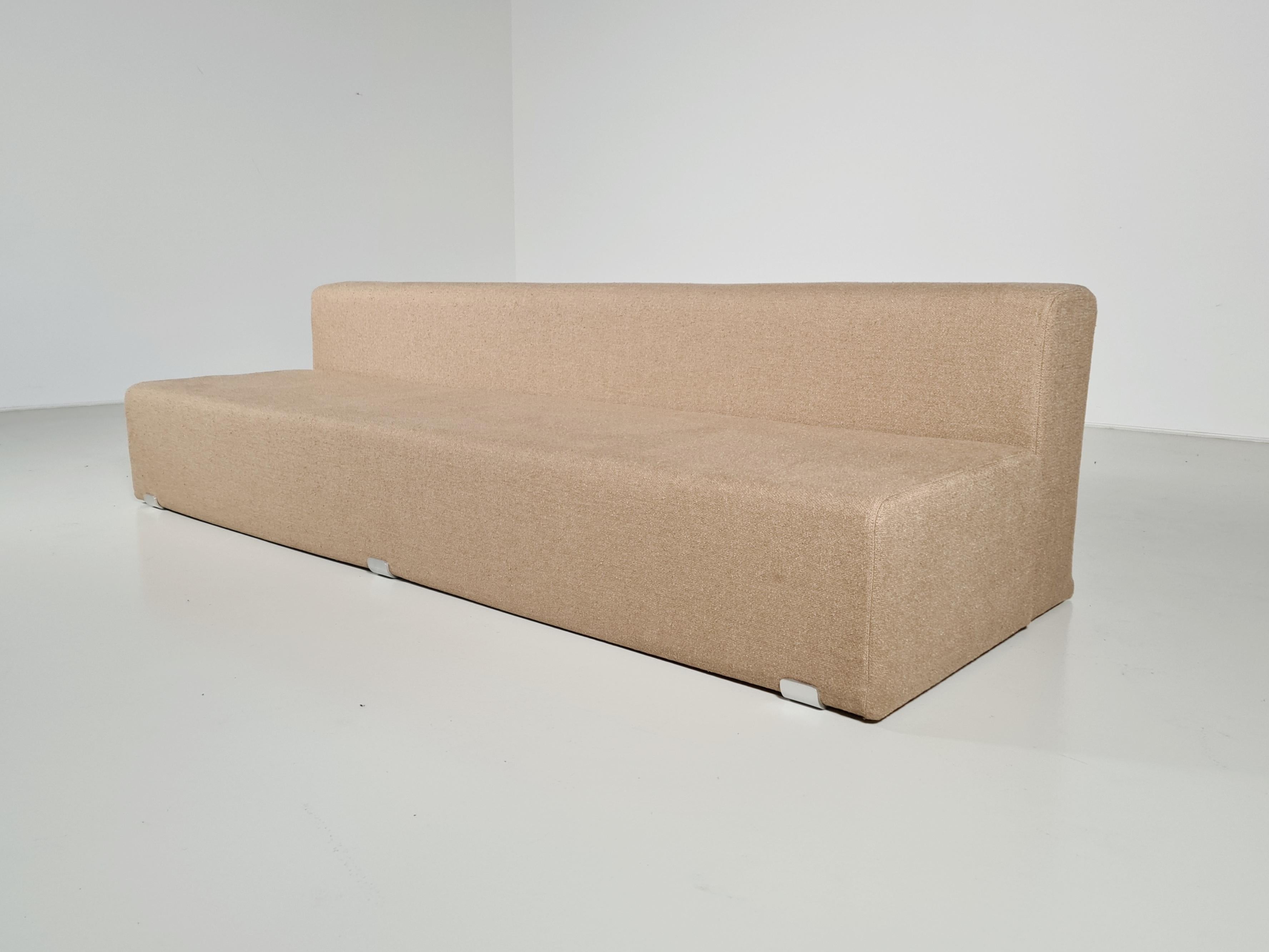 Marcel 3-seater sofa, designed by Kazuhide Takahama and manufactured by Gavina, features a shaped polyurethane structure with polished aluminum brackets. Reupholstered in a beautiful beige Tactile bouclé by Kirkby Design. The Marcel collection, a