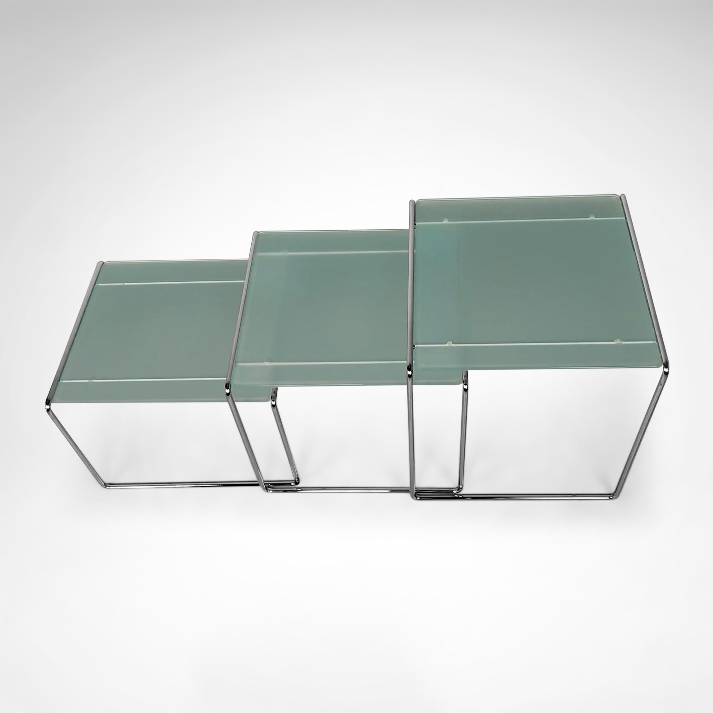 Minimalist design side table, inspired by Mies van der Rohe with simple abstract lines. The metal lower frame is bent steel and consist of 1 part. The entire design looks very sleek due to its thin shaped frame. The milk glass plate lays on top of