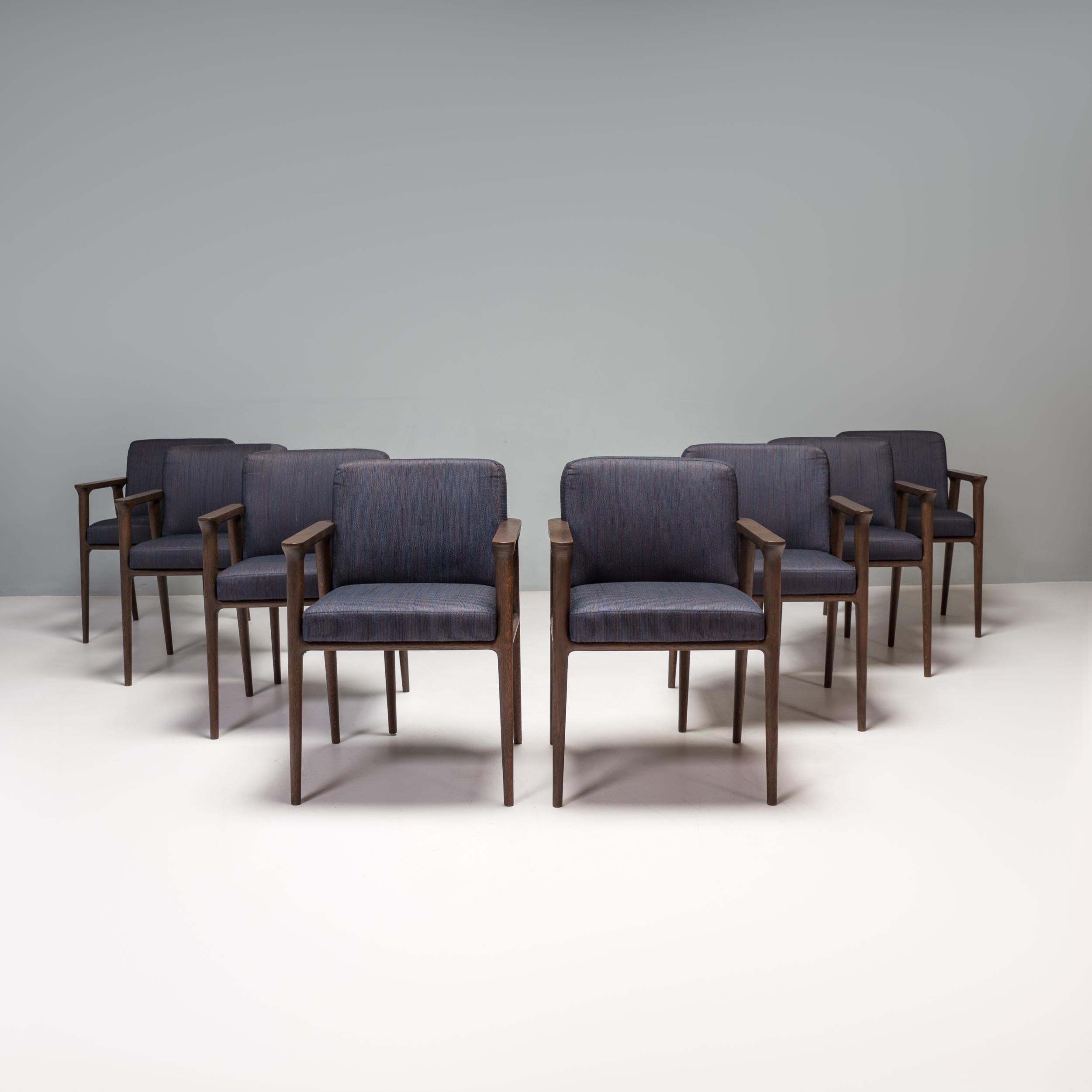 Originally designed by Marcel Wanders for Moooi in 2013, the Zio range exudes classic elegance.

Constructed from wenge stained oak frames, the dining chairs feature tapered legs and a rounded back rest.

The separate seat and back cushions are
