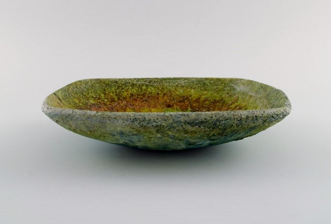 Marcello Fantoni (b.1915), Italy. 
Unique bowl in glazed ceramics. Beautiful glaze in shades of green and blue. 
1960s.
Measures: 23 x 5.5 cm.
In excellent condition.
Signed.
