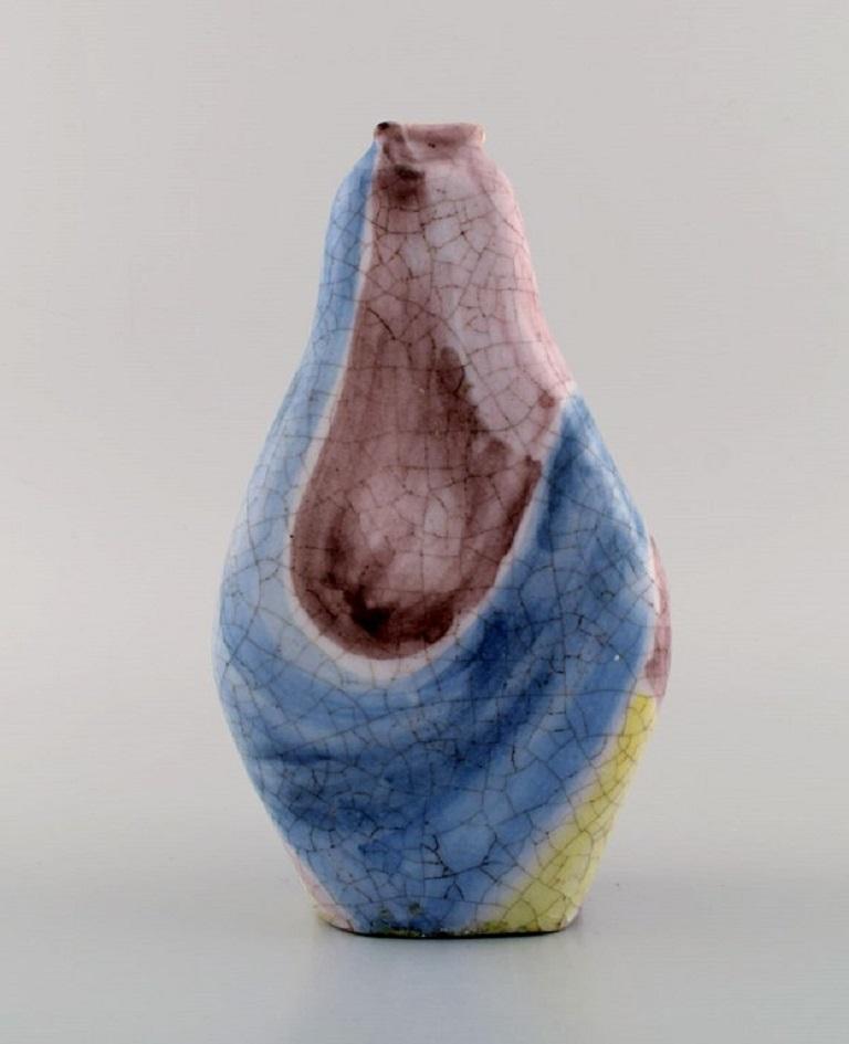 Marcello Fantoni (b.1915), Italy. Unique vase in glazed ceramics. Beautiful polychrome glaze. 1960s.
Measures: 21 x 12 cm.
In excellent condition.
Signed.