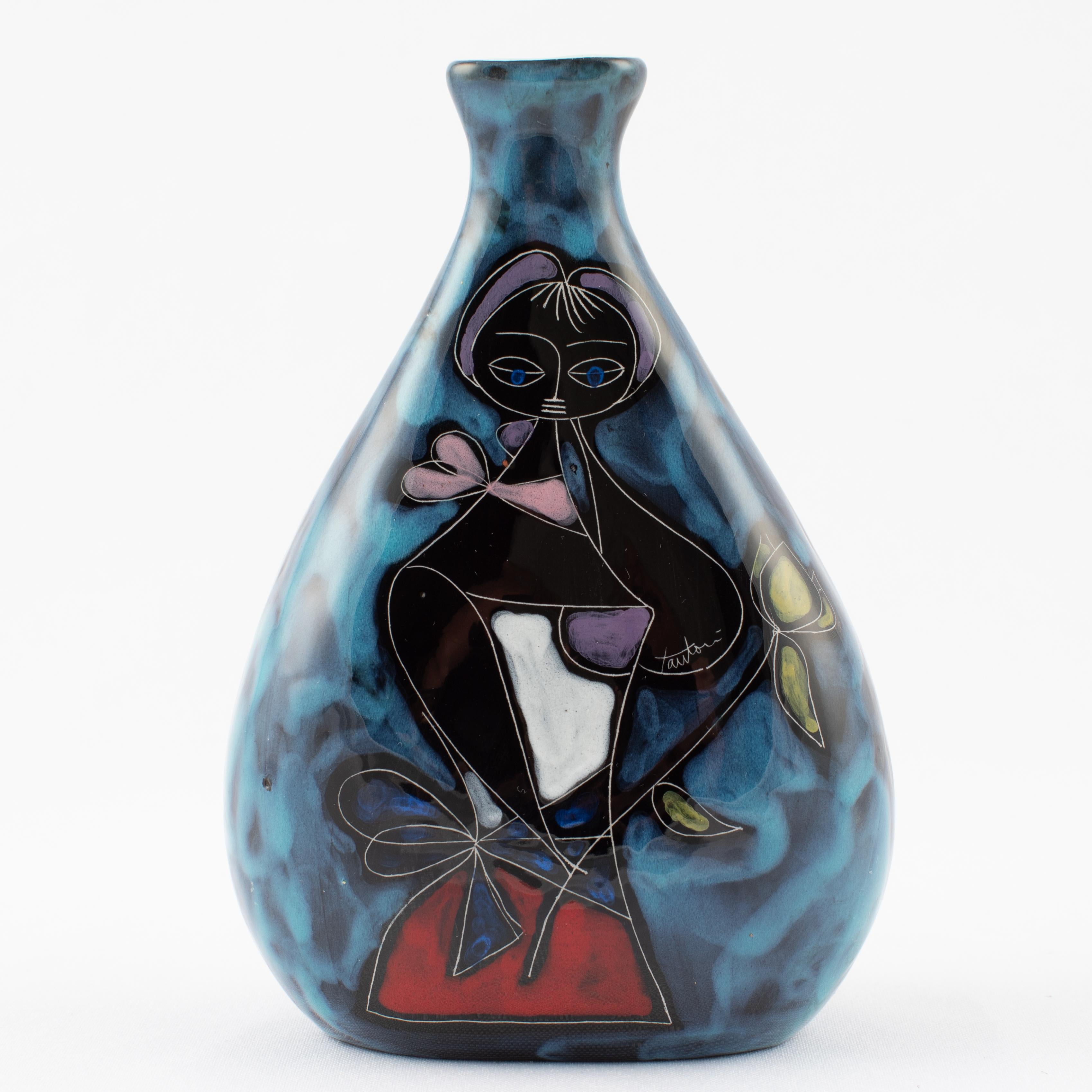 Shapely bud vase with incised female figure by Italian master Marcello Fantoni. Mottled blue background surrounds a stylized midcentury female figure rendered in lavenders, red, blue and white, holding a green flower. Sky-blue interior glaze. Signed