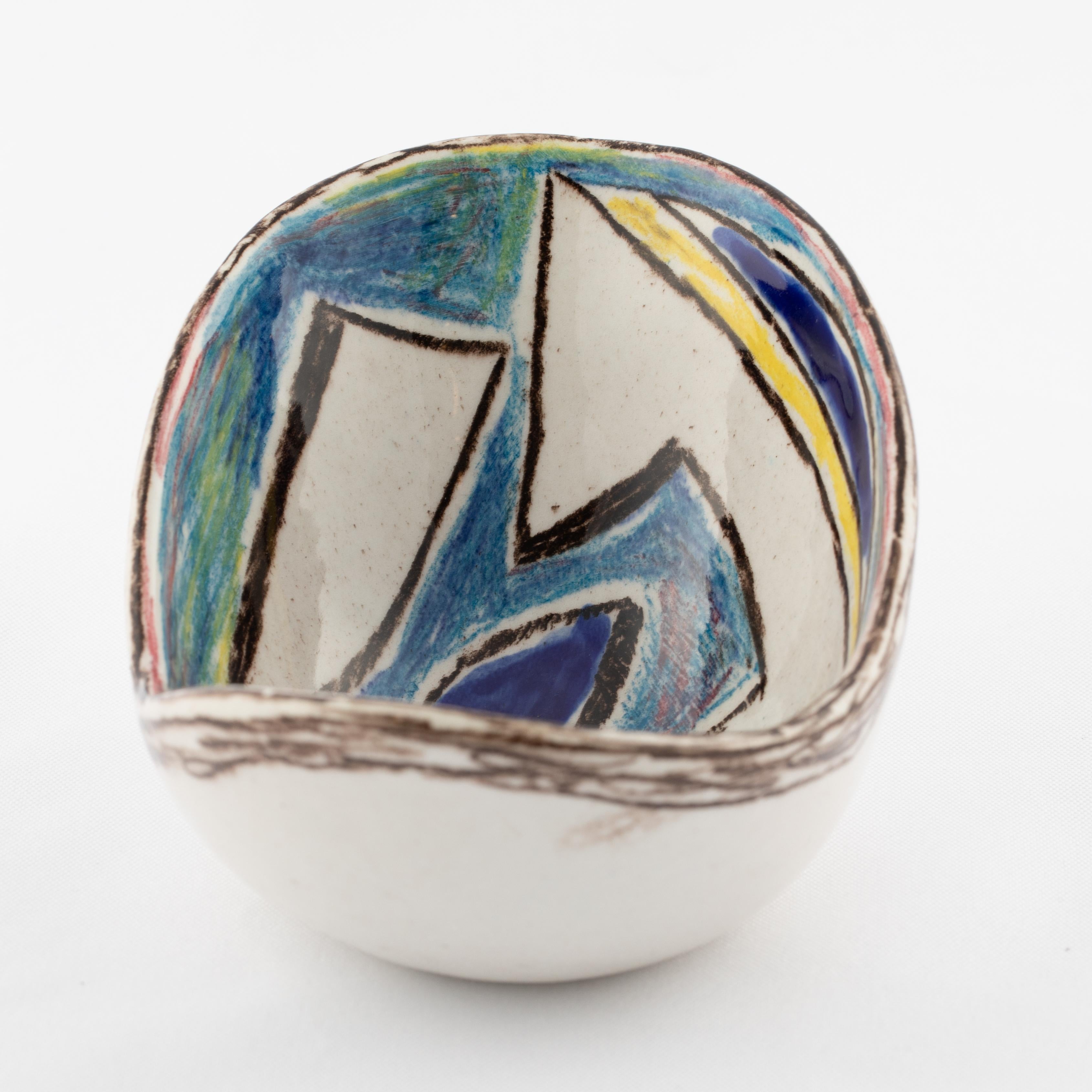 Lovely ceramic bowl with a hand painted abstract glaze design by artist Marcello Fantoni. Partial signature to the bottom. 

