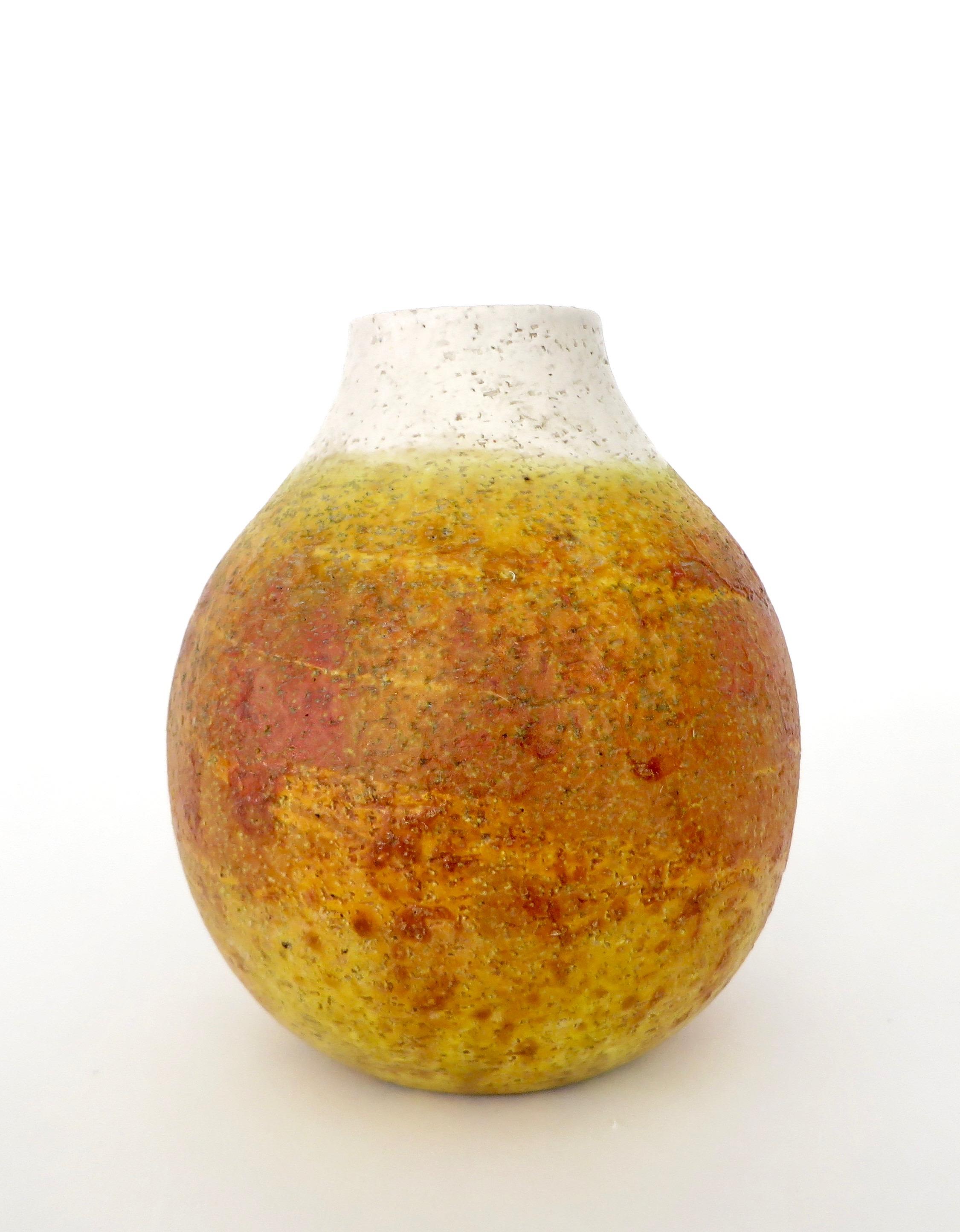 Marcello Fantoni ceramic vessel vase. Signed on bottom Fantoni, Italy. 
A generous rounded form with a white glaze at the neck and orange yellow glaze covering the remainder of the vase. 
 