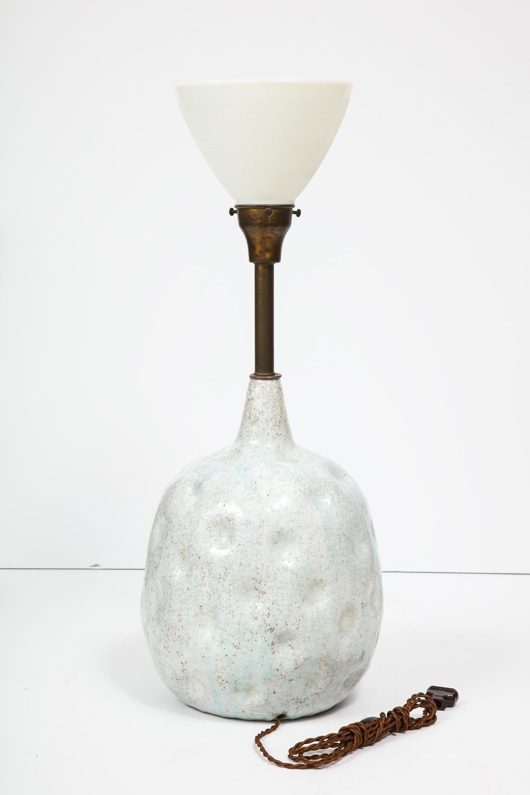 Large, dimpled stoneware lamp with a robin's egg drip glaze and ovoid shape. By Italian master Marcello Fantoni, produced in Italy, circa 1950s. Overall height to the top of the glass is 27.5