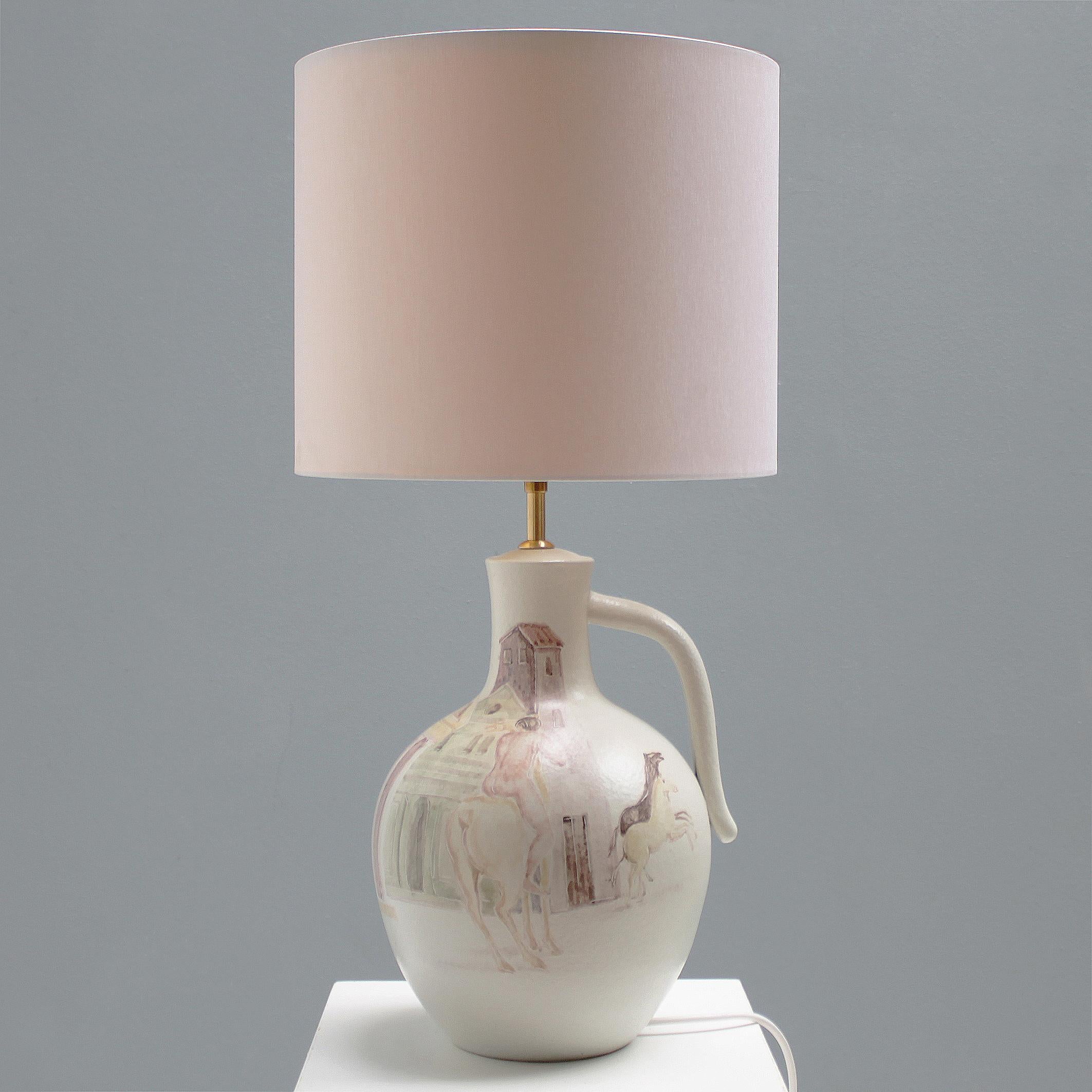 Table lamp as an earthenware vase, hand painted Etruscan figures in beautiful light earth tones. Rare early work by the Italian artist Marcello Fantoni. 
Dimensions (without shade): height inc. bulb holder 33.5 in. (42 cm), diameter: 15.4 in. (22