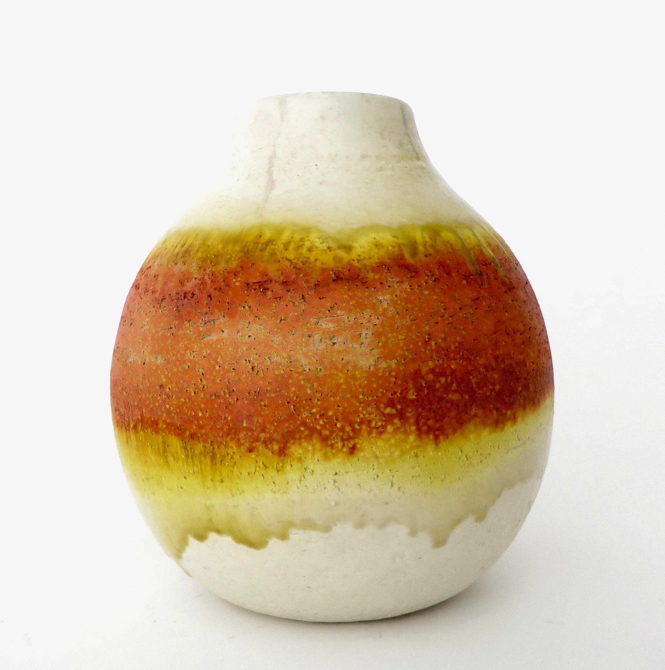 Marcello Fantoni ceramic vessel vase. Signed on bottom Fantoni, Italy. 
A generous rounded form with a beautiful orange breaking to yellow, green and white glaze. 
 