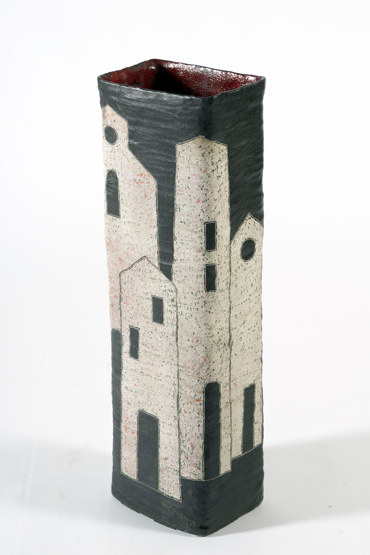 Large ceramic vase by master ceramist Marcello Fantoni Florence Italy from the 1950s, double decoration on one side of opaque black and white houses on the other side colored characters in glossy enamel.
Inside this vase is red.
Signed lower left