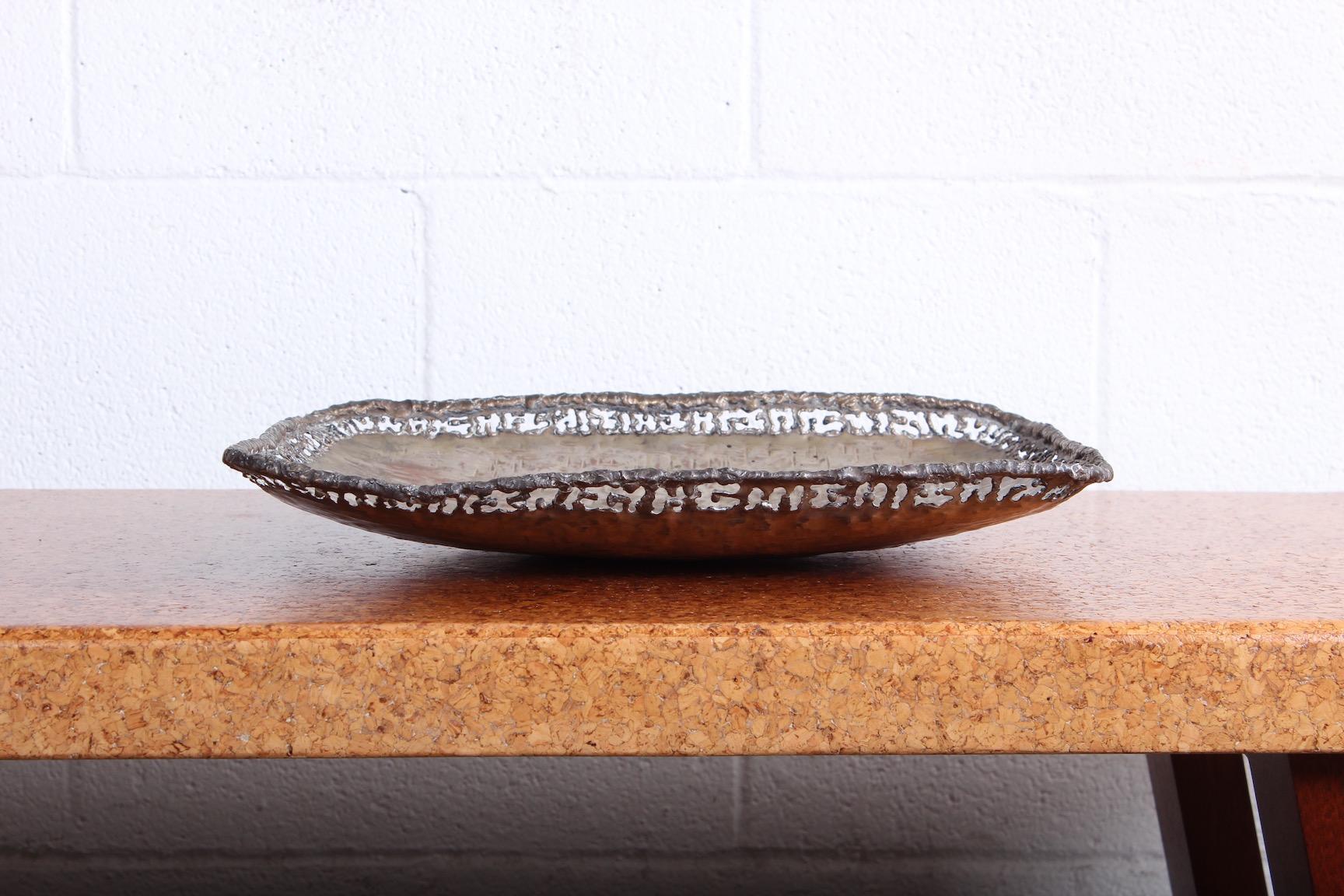 A nicely patinated platter by Marcello Fantoni in silvered copper.