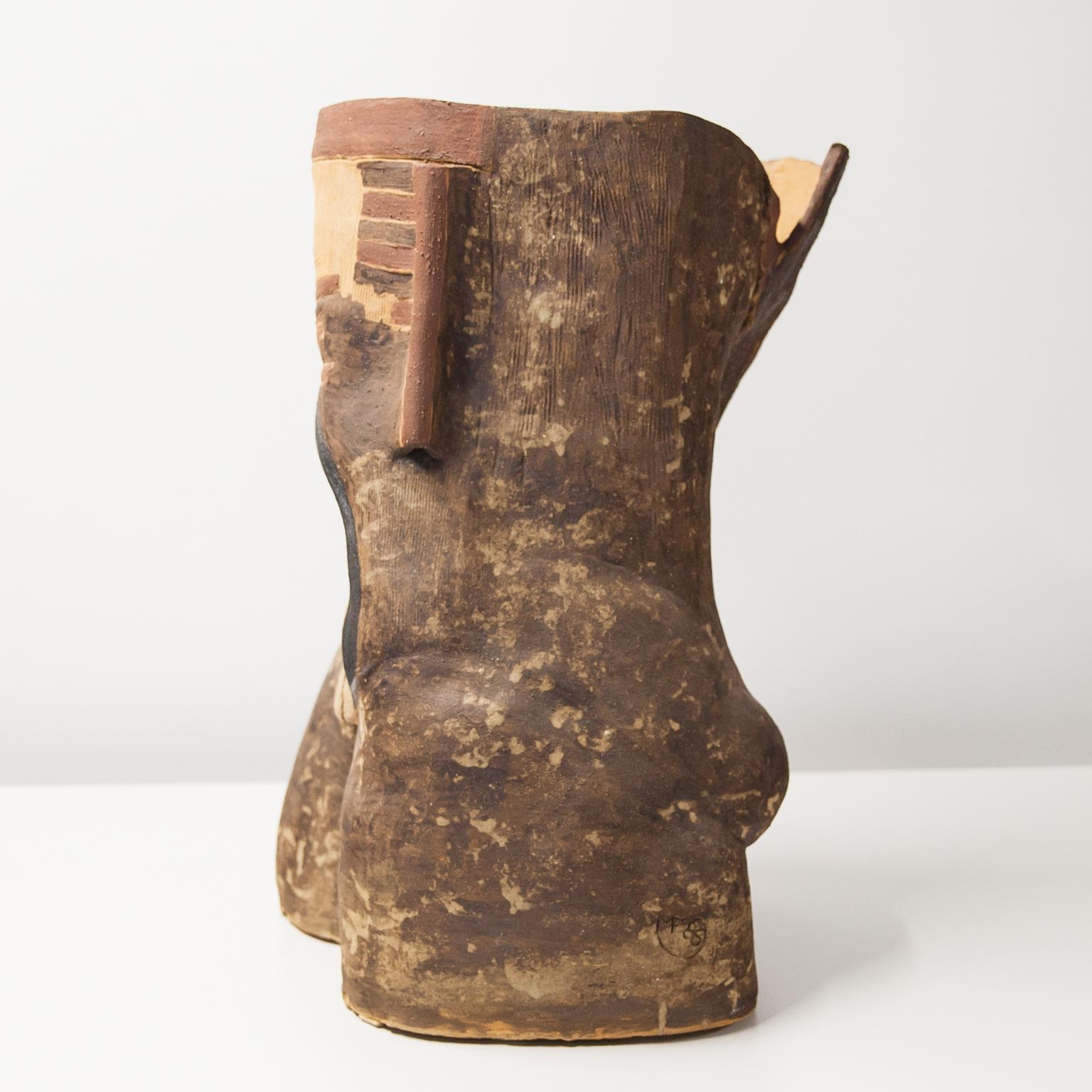Very beautiful and unusual work from the late work of Marcello Fantoni, designed in the form of a torso in earth-colored unglazed ceramic and reminiscent of Roman terracotta ceramics of antiquity paired with the style of mythological terracotta