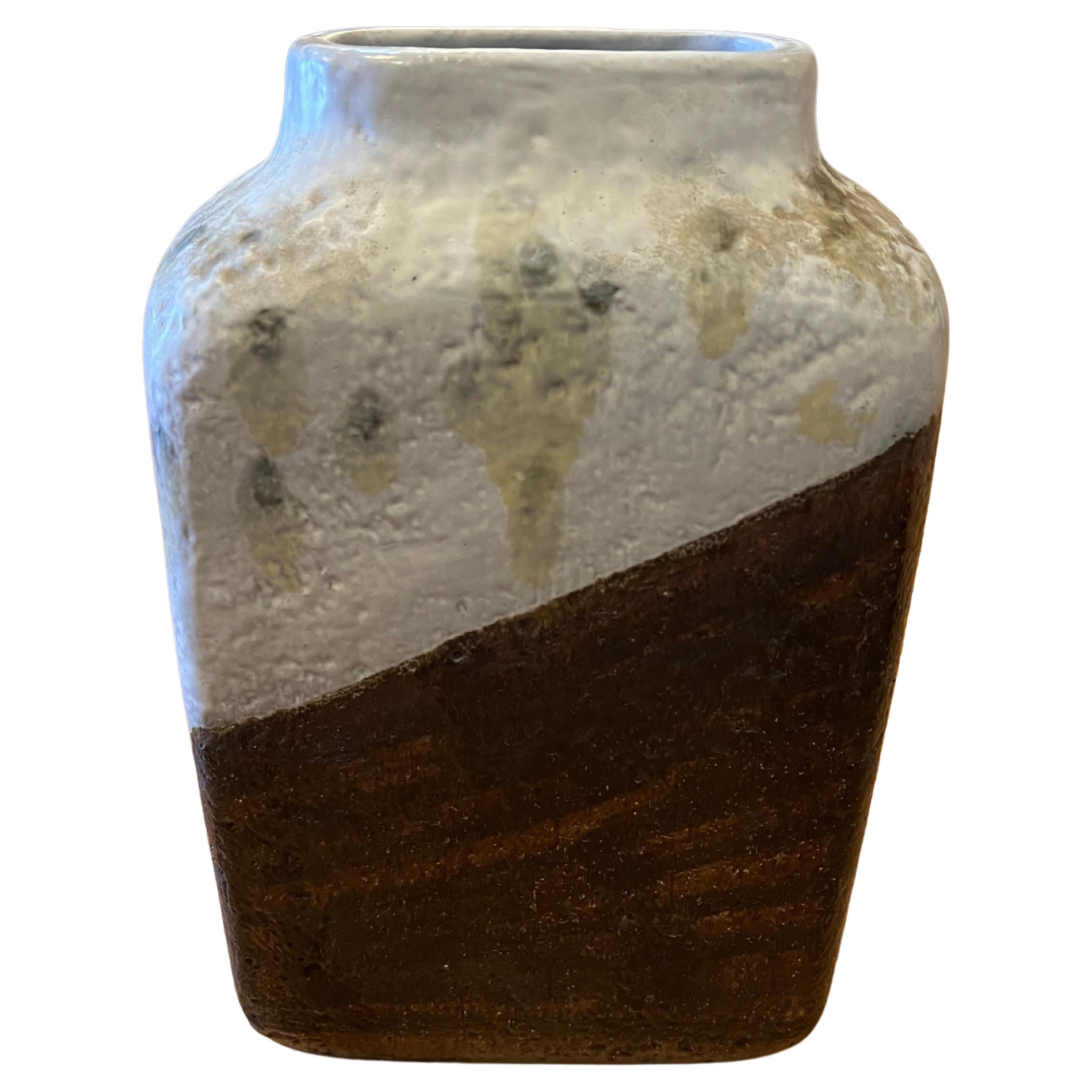 

Immerse your space in the timeless allure of mid-century Italian craftsmanship with this exquisite Marcello Fantoni Bitone Vase. Crafted circa 1955, this ceramic masterpiece epitomizes Fantoni's mastery, showcasing his distinct blend of artistic