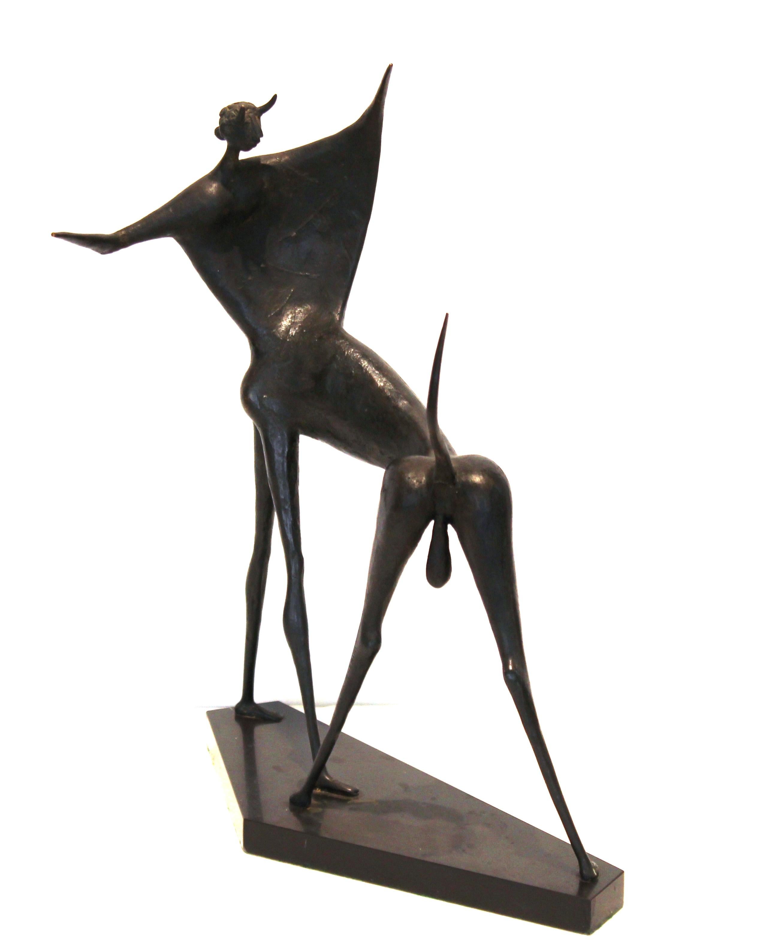 Italian midcentury bronze sculpture titled 'Corrida' and created by Marcello Mascherini (Italy 1906-1983) in 1957. The piece depicts an abstracted bullfighter in movement and is mounted on a black marble base. Signed by the artist on the leg