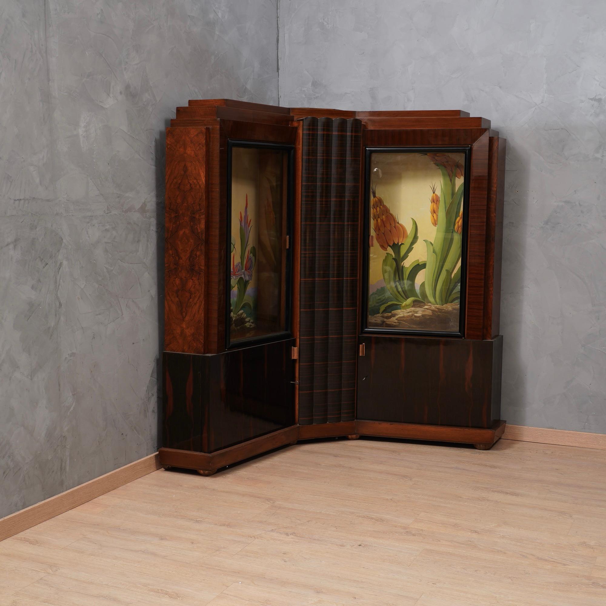 Astonishing corner cupboard attributed to Marcello Piacentini, important Italian furniture veneered in walnut and Macassar wood, to note its unique design and the two interior paintings, finely painted.

Corner cupboard formed by four doors, two